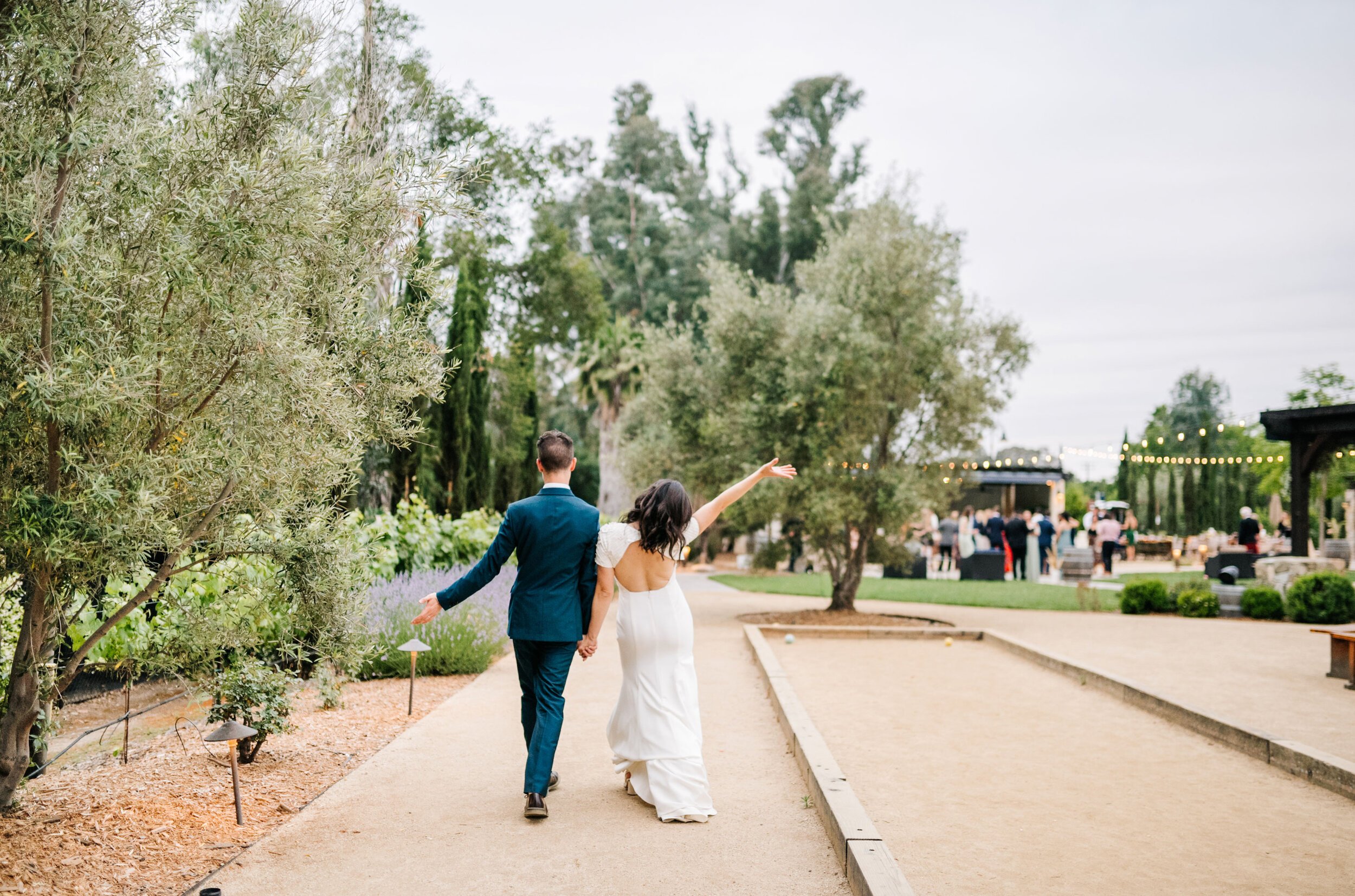 www.santabarbarawedding.com | White Sage | Topa Mountain Winery | Cara Robbins Studios | Olivetta Flowers | Sarah Seven | Bride and Groom Walking to Reception