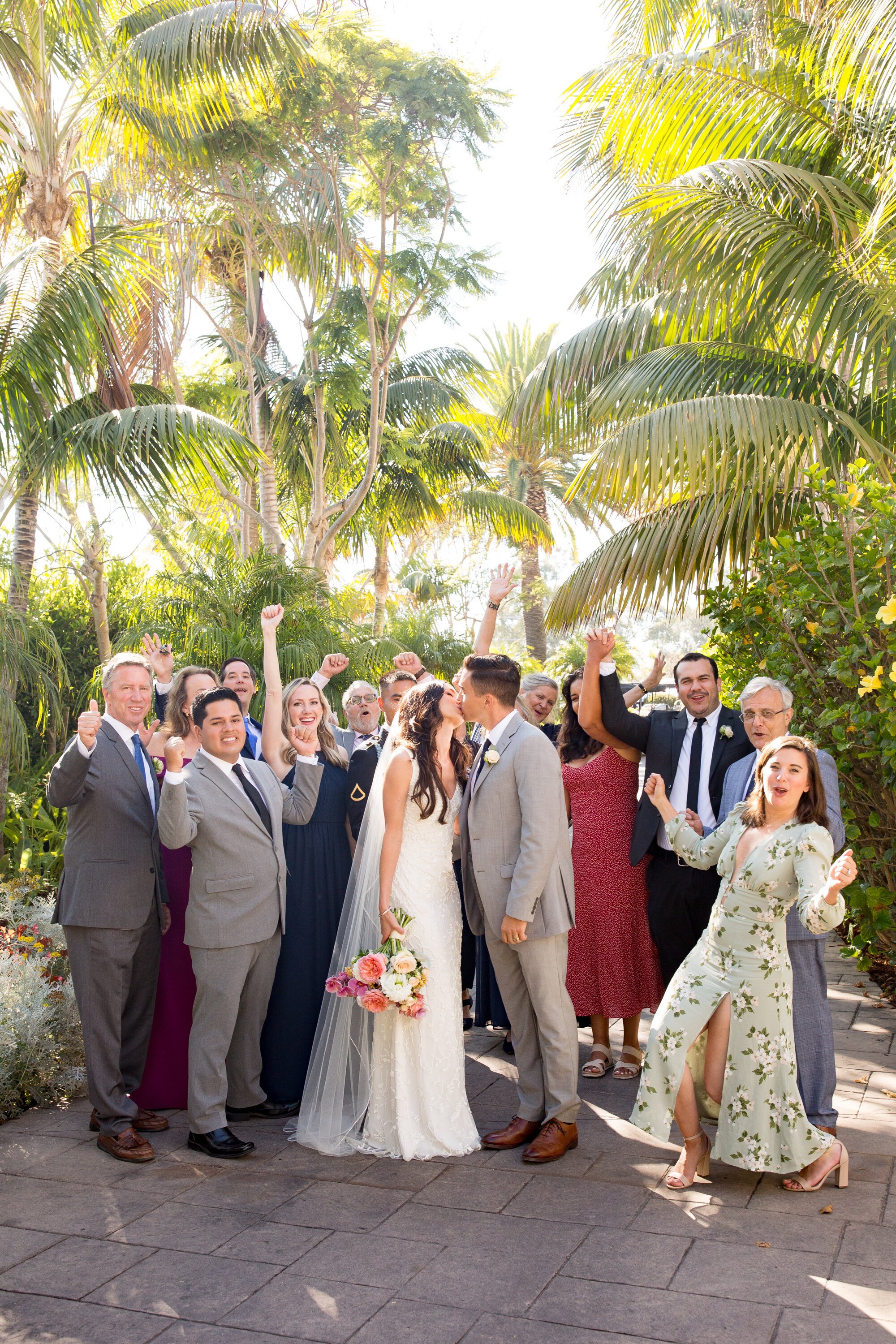 www.santabarbarawedding.com | Kelsey Crews Photo | Ella &amp; Louie | Bride and Groom Kiss Among All Their Wedding Guests