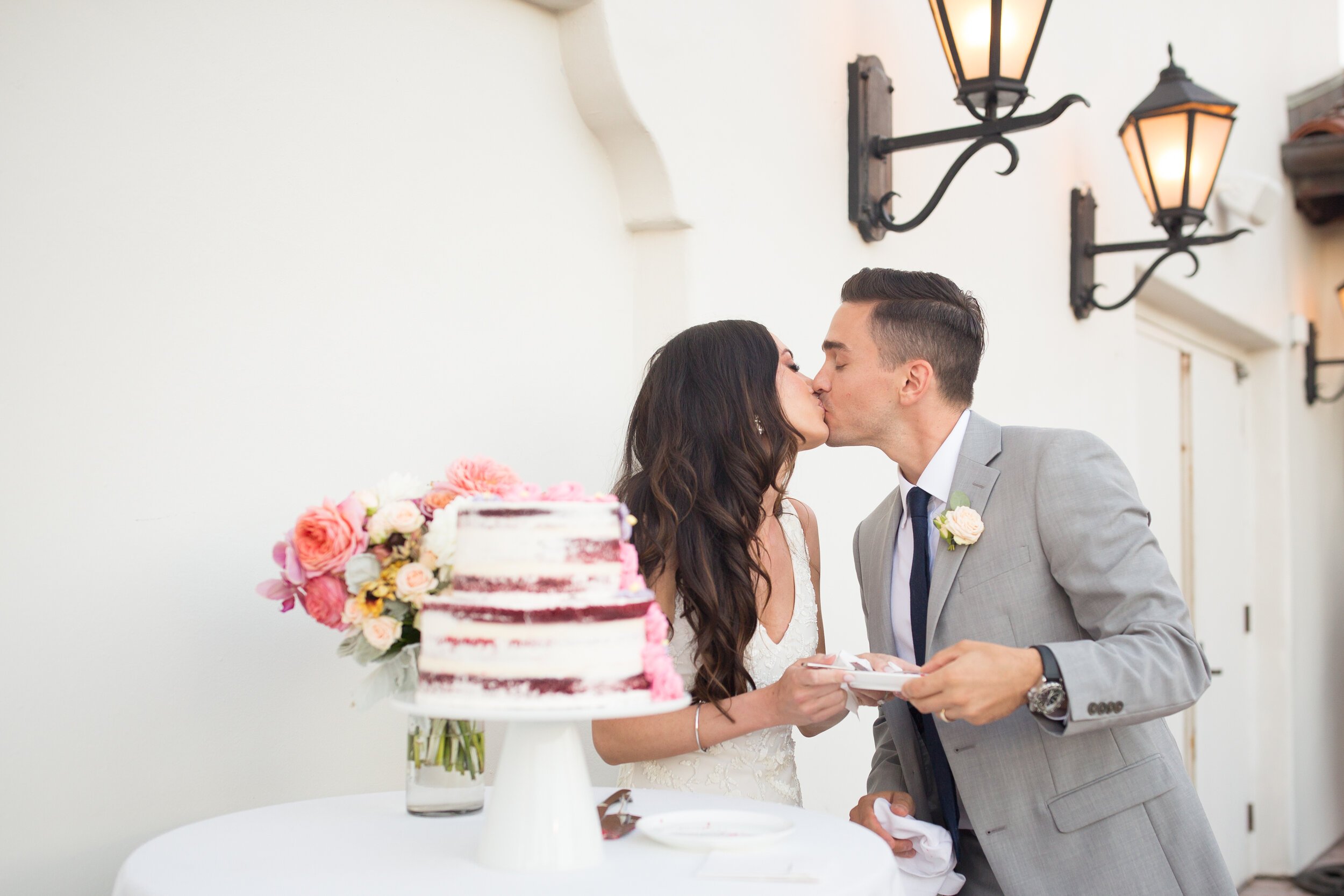 www.santabarbarawedding.com | Kelsey Crews Photo | Ritz-Carlton Bacara | Ella &amp; Louie | Bride and Groom Feeding Cake to Each Other at the Reception