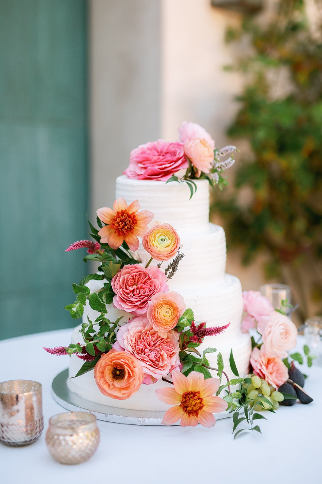 www.santabarbarawedding.com | The Little Things Bakery | Anna Delores Photography | Three Tier White Wedding Cake with Pink and Orange Flowers
