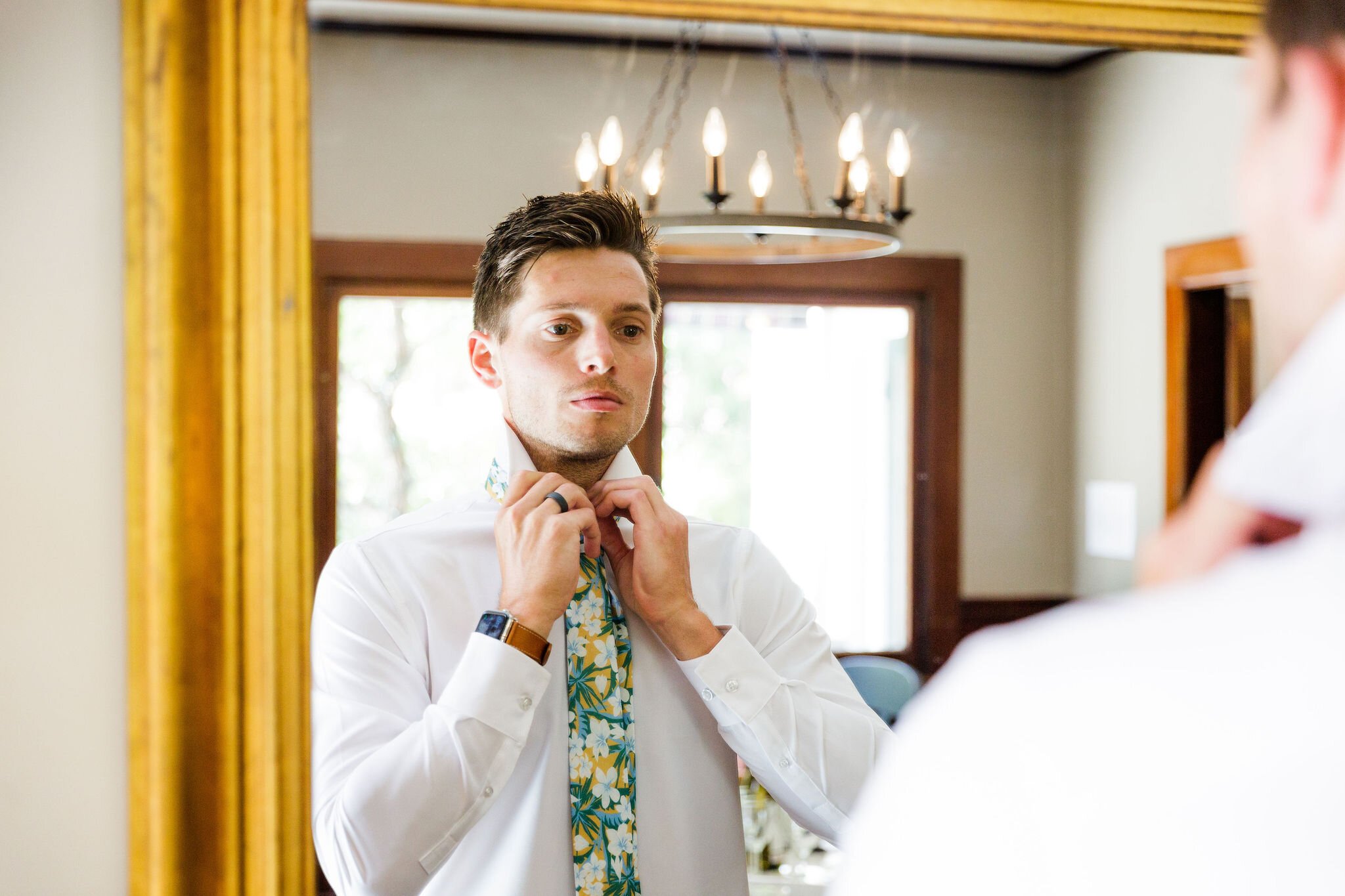 www.santabarbarawedding.com | Head &amp; Heart Photography | Rincon Beach Club | Events by Rincon | The Twisted Twig | Groom Getting Ready with Floral Tie