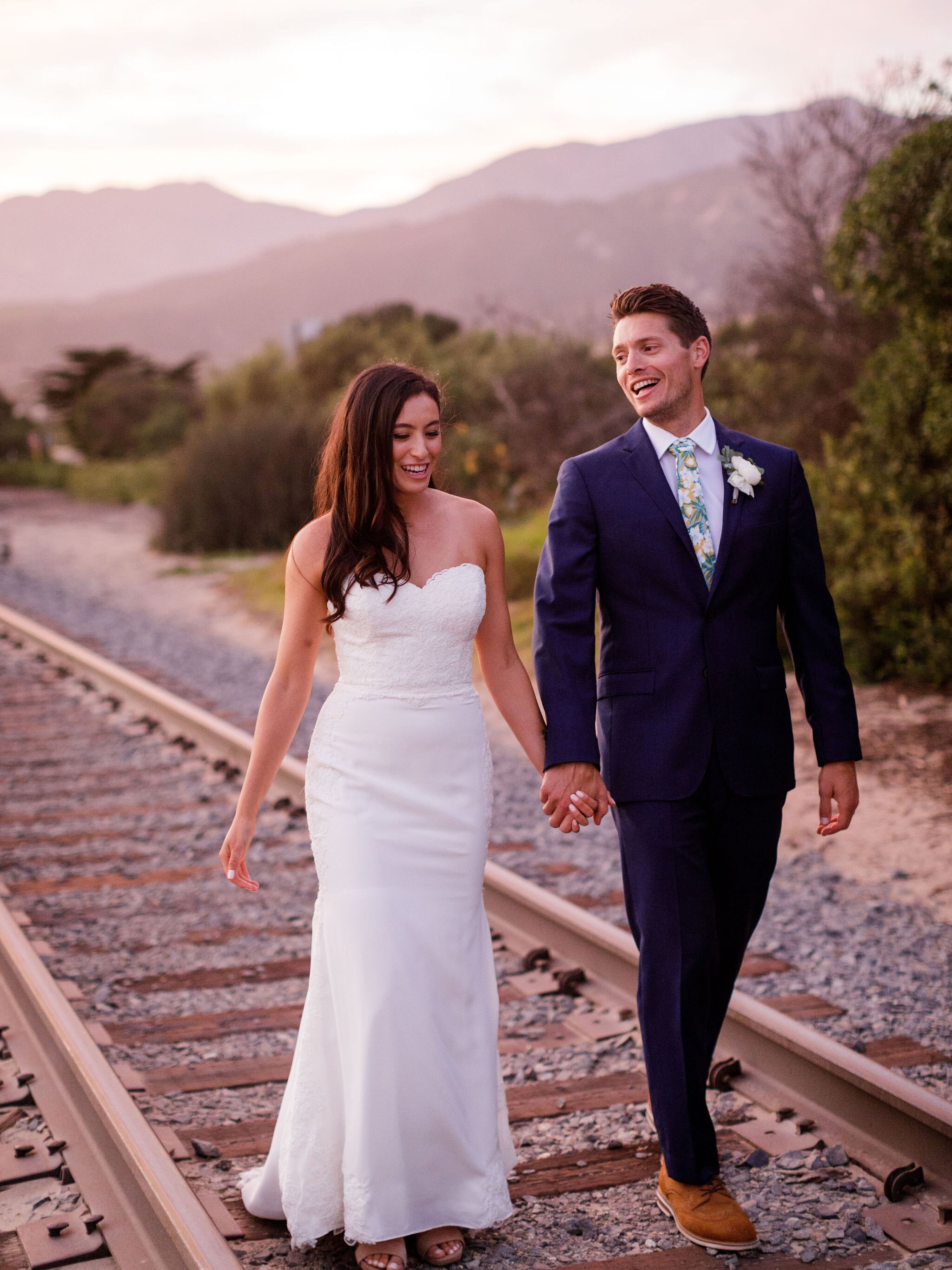 www.santabarbarawedding.com | Head &amp; Heart Photography | Rincon Beach Club | Events by Rincon | The Twisted Twig | Bride and Groom on the Railroad Tracks