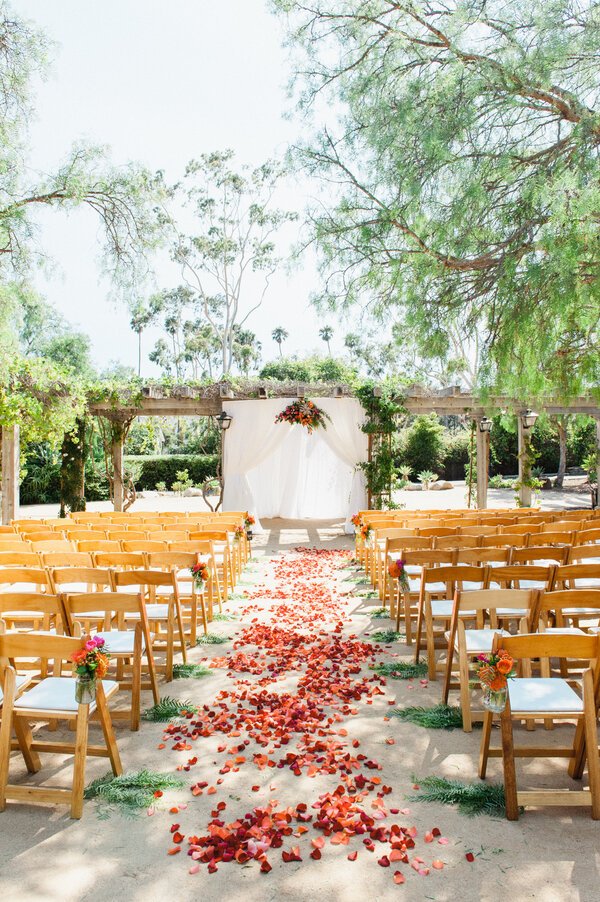 www.santabarbarawedding.com | Santa Barbara Historical Museum | Grace Kathryn Photography | Ceremony Set Up in Adobe Courtyard with Flower Petals Covering the Ceremony Aisle