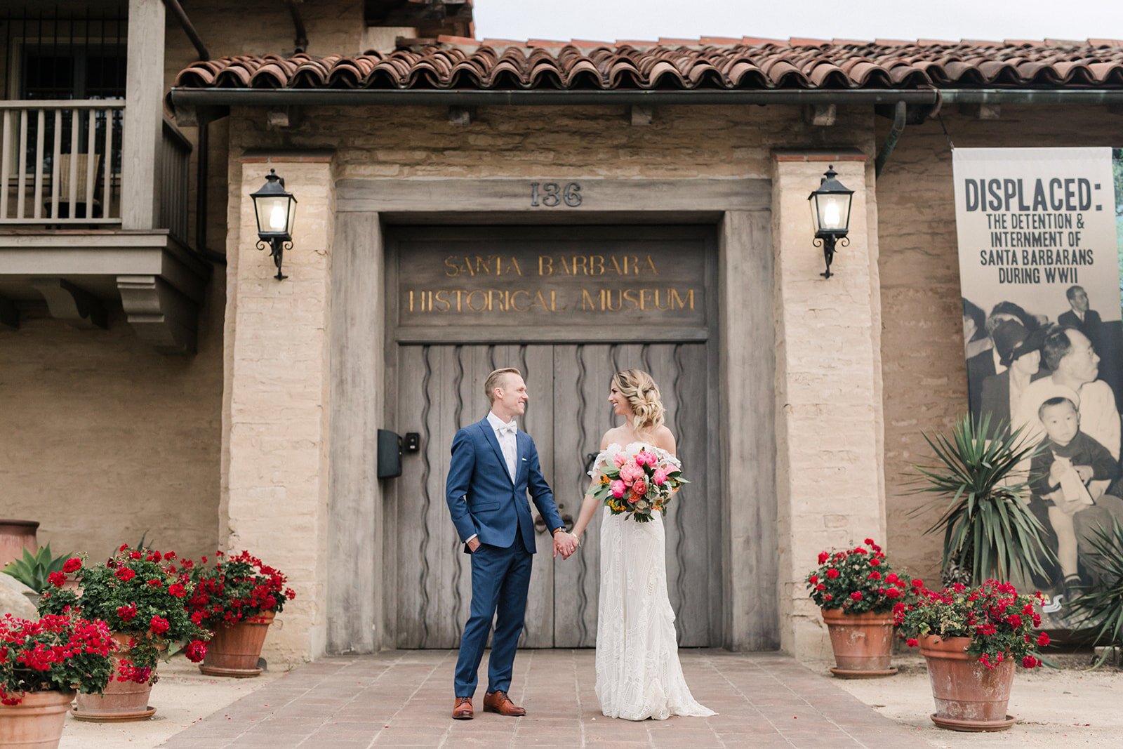 www.santabarbarawedding.com | Santa Barbara Historical Museum | Anna Delores Photography | Couple in Front of the Front Door Sign