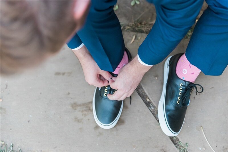 www.santabarbarawedding.com | Events by M and M | Anne Marie Studios | Ocean View Farm | Unique Floral Designs | Groom Tying His Shoes with Pink Socks On