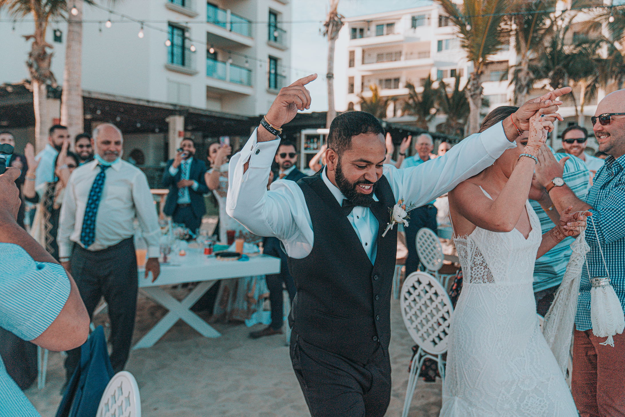 www.santabarbarawedding.com | Golden Glow Weddings | Bride and Groom Walking Into Their Reception