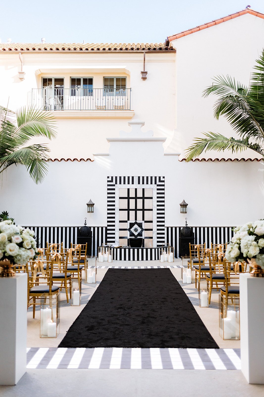www.santabarbarawedding.com | Sunwest Video | Tangled Lotus | Ceremony Aisle with Black and White Decor and Black Aisle Runner