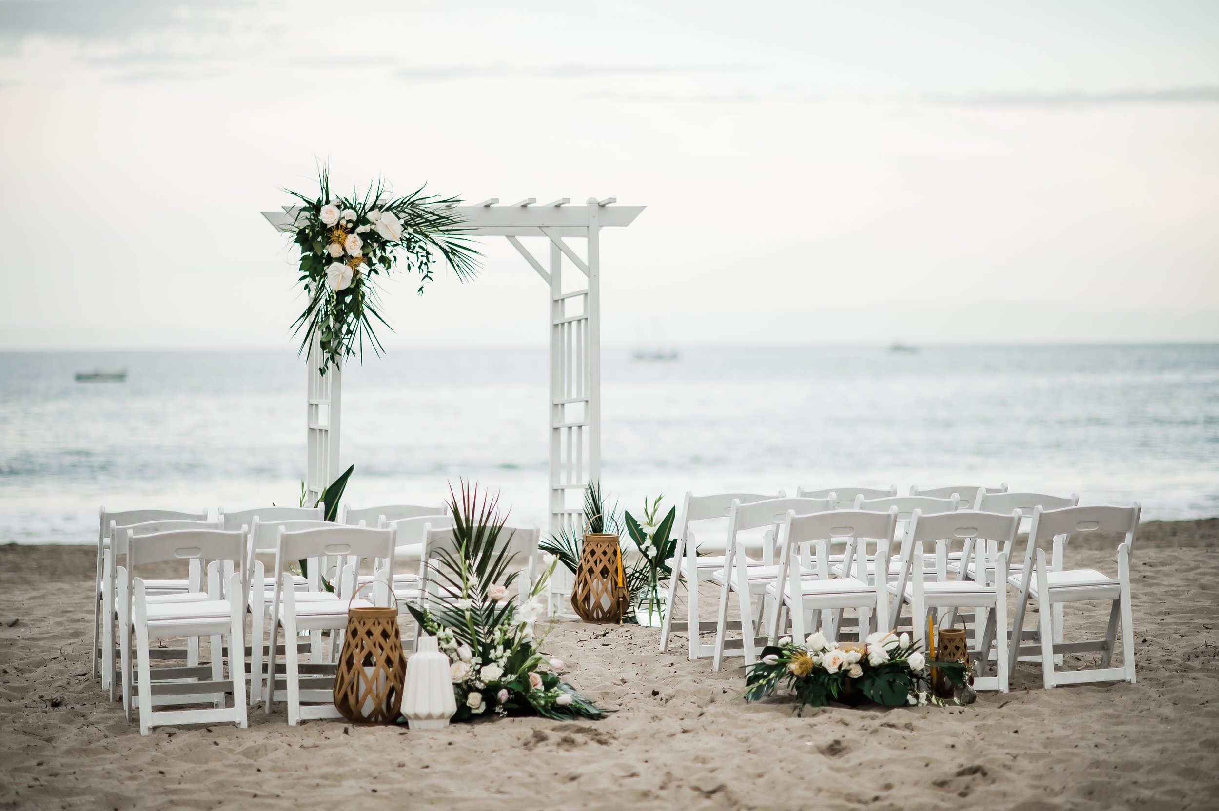 www.santabarbarawedding.com | Michelle Ramirez Photography | Tangled Lotus | Flowers and Lanterns at the Ceremony on the Beach