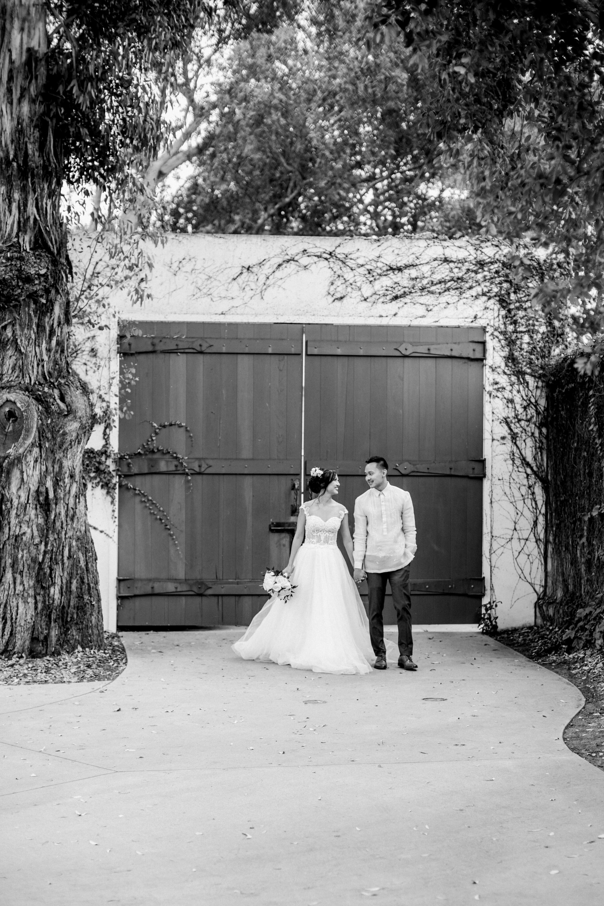 www.santabarbarawedding.com | Events by Fran | Chase Palm Park | Anna Delores Photography | Tangled Lotus | Pineapple Industries | Mila Bridal | Joel Sebastian | Couple in Front of Big Green Doors
