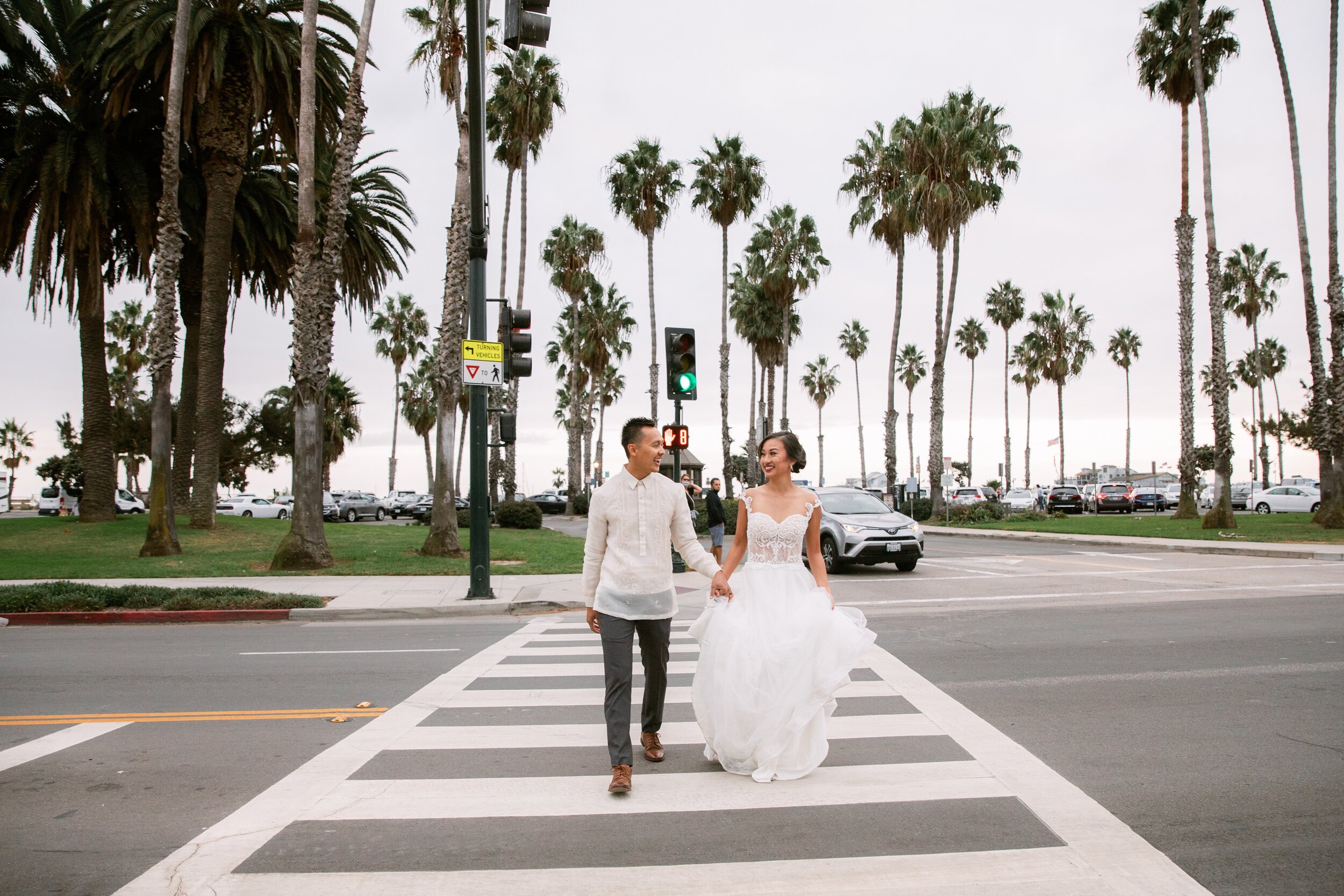 www.santabarbarawedding.com | Events by Fran | Chase Palm Park | Anna Delores Photography | Tangled Lotus | Pineapple Industries | Mila Bridal | Joel Sebastian | Bride and Groom Crossing the Street