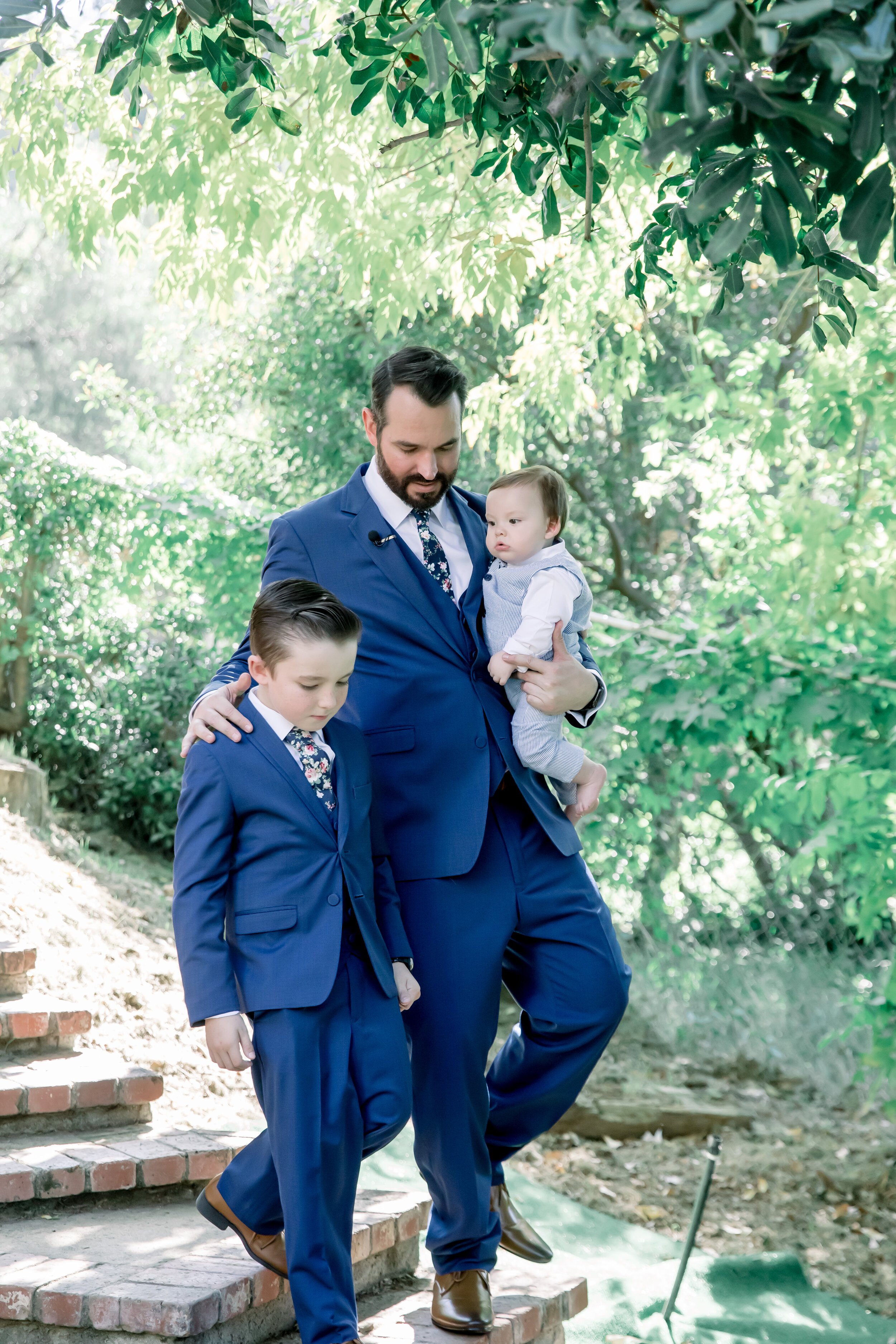 www.santabarbarawedding.com | Rewind Photography | Events by M and M | The Twisted Twig | A Rental Connection | Groom Walking Into Ceremony with Two Sons