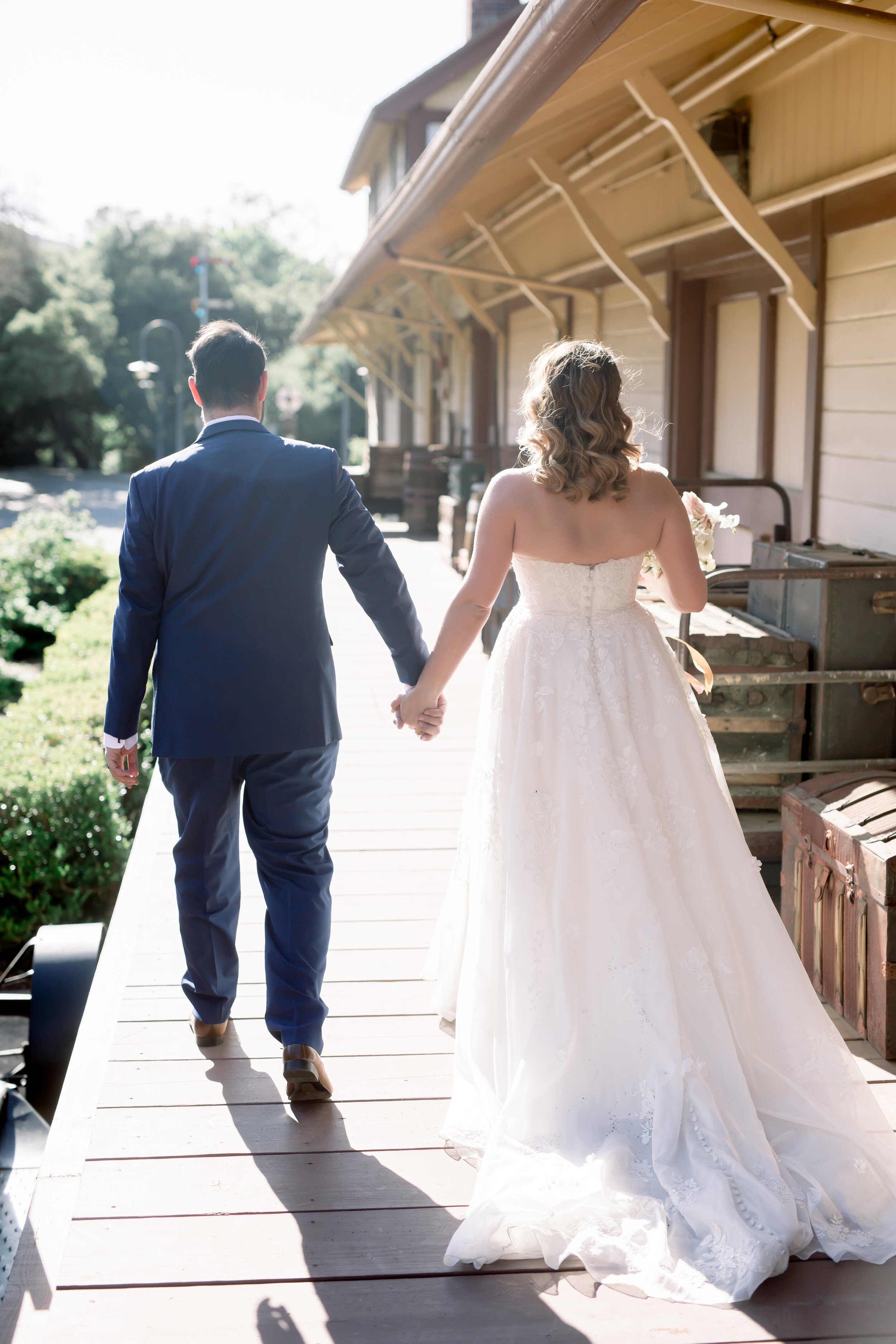 www.santabarbarawedding.com | Rewind Photography | Events by M and M | The Twisted Twig | Bliss Bridal Beauty | Bride and Groom Walking Away on the Porch