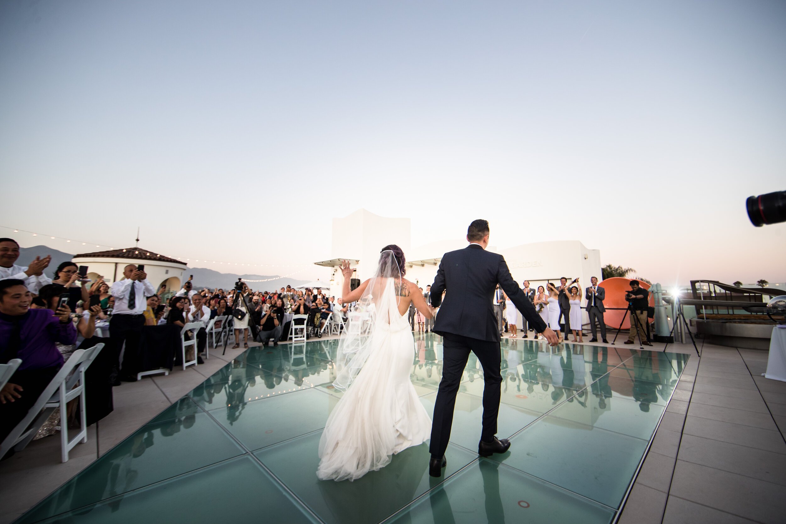 www.santabarbarawedding.com | MOXI | Justin Element | Chiellebrate Events | Grassroots Florals | Ventura Rentals | Islay Events | DJ Etunes | Bride and Groom Entering the Museum Rooftop