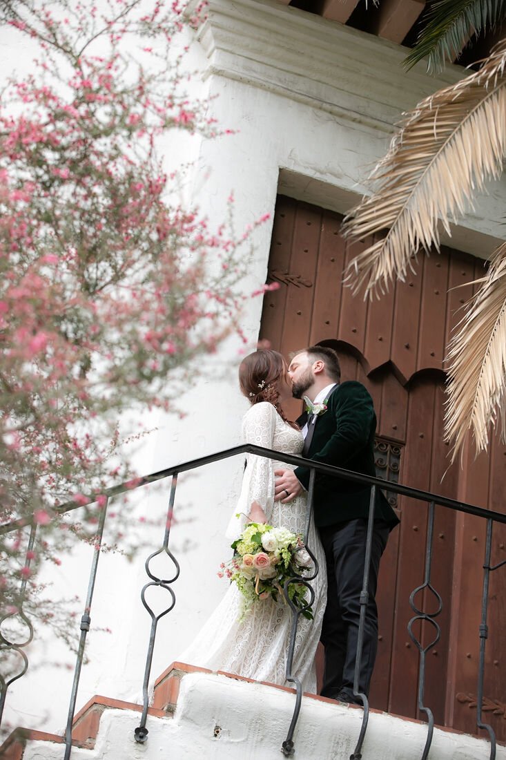 www.santabarbarawedding.com | Santa Barbara Courthouse | Claudia Craig | Garden Florist | BHLDN | Men’s Wearhouse | Willowby by Watters | Bride and Groom on Courthouse Steps