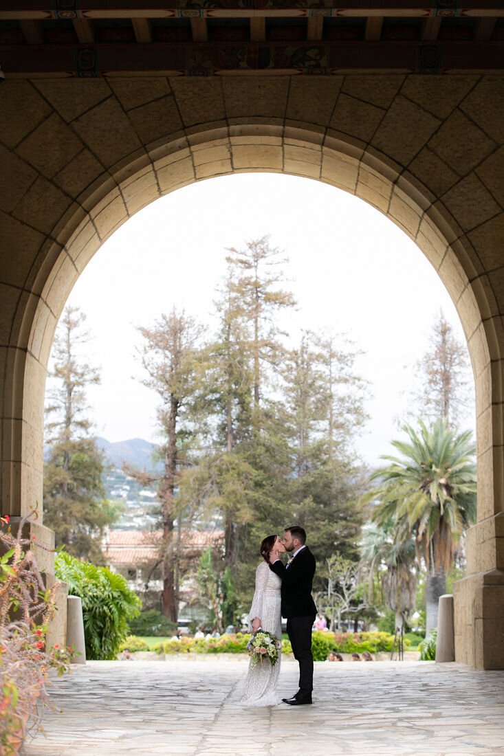 www.santabarbarawedding.com | Santa Barbara Courthouse | Claudia Craig | Garden Florist | BHLDN | Men’s Wearhouse | Willowby by Watters | Bride and Groom Kiss at the Courthouse