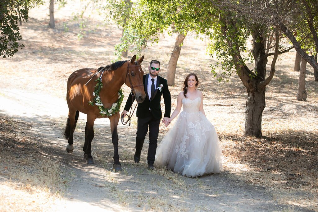 www.santabarbarawedding.com | Santa Barbara Courthouse | Claudia Craig | Garden Florist | BHLDN | Men’s Wearhouse | Chatt Chako | DryBar Westlake Village | Bride and Groom with Horse