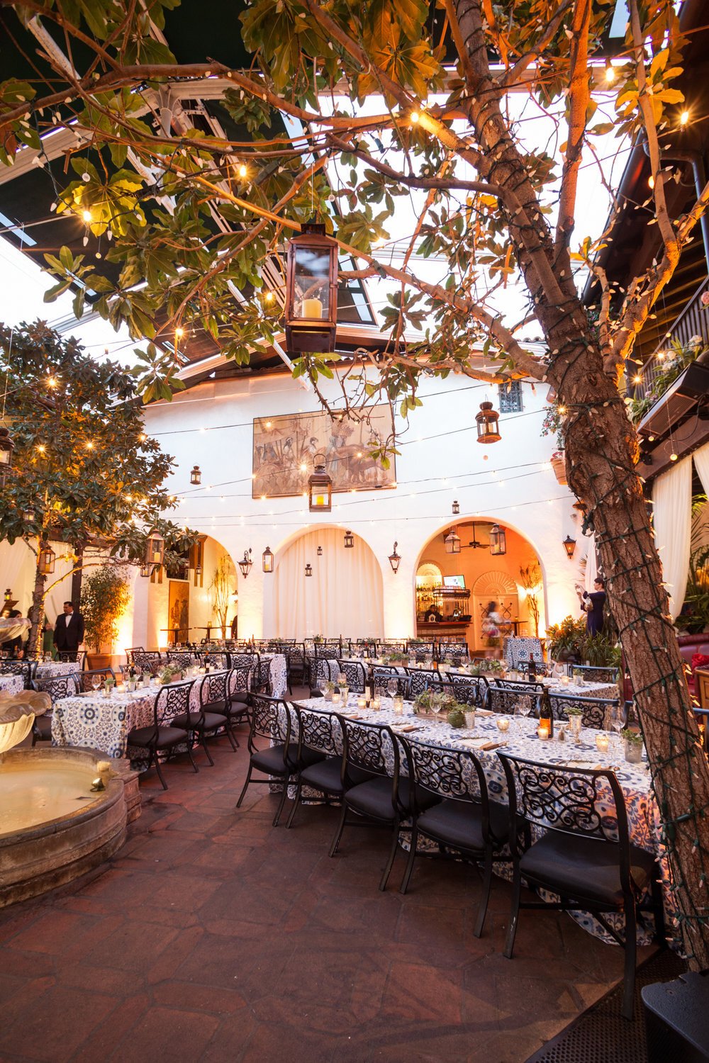 www.santabarbarawedding.com | SPARK Creative Events | Twinkling Lights Wrapped Around a Tree and Lanterns at Outdoor Reception