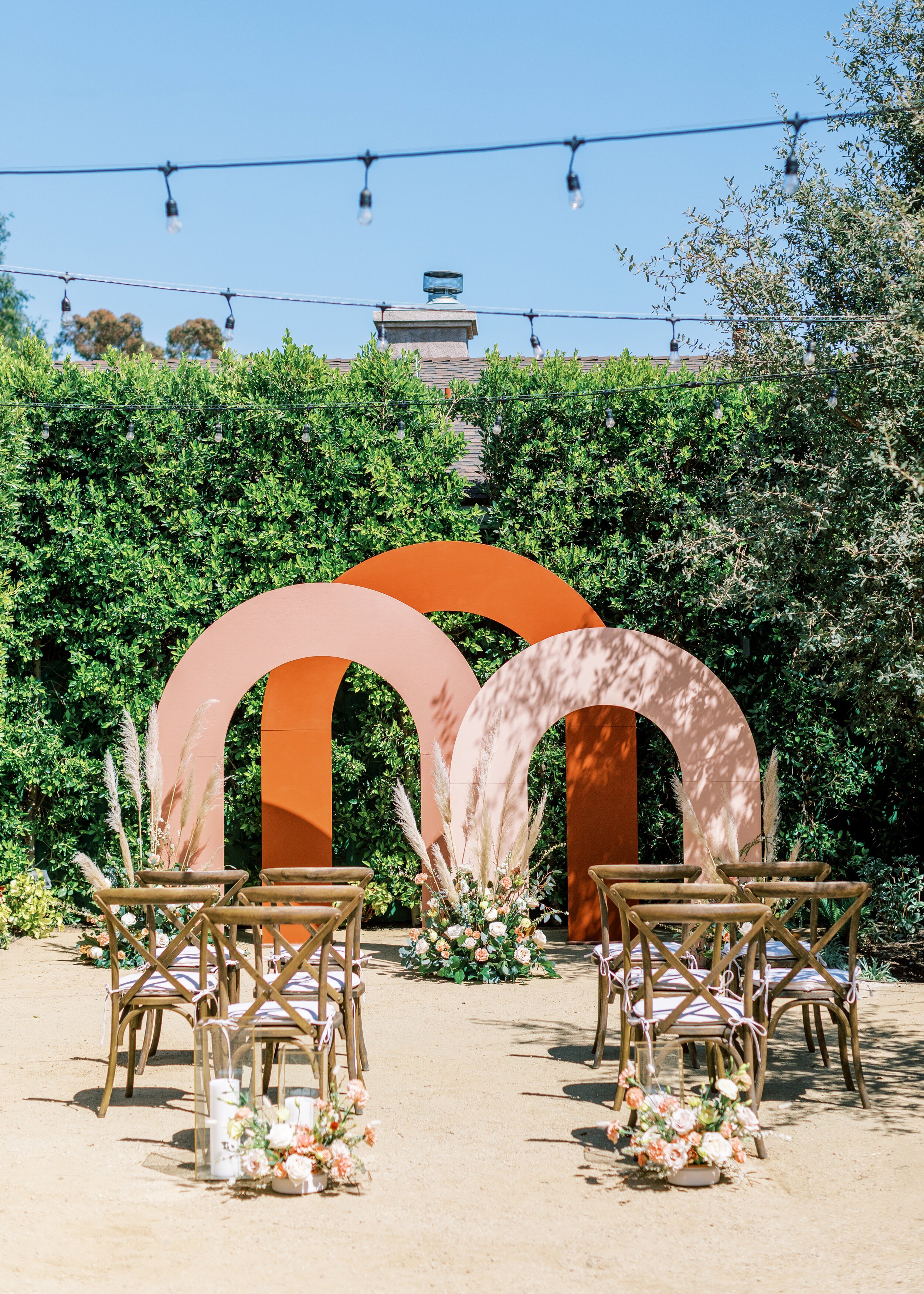 www.santabarbarawedding.com | Events by Fran | Ever After Petite Venue | Kendall Ann Photo | Tangled Lotus | Amigo Party Rentals | Harpist VeeRonna | The Ceremony Set Up with Rainbow Arches