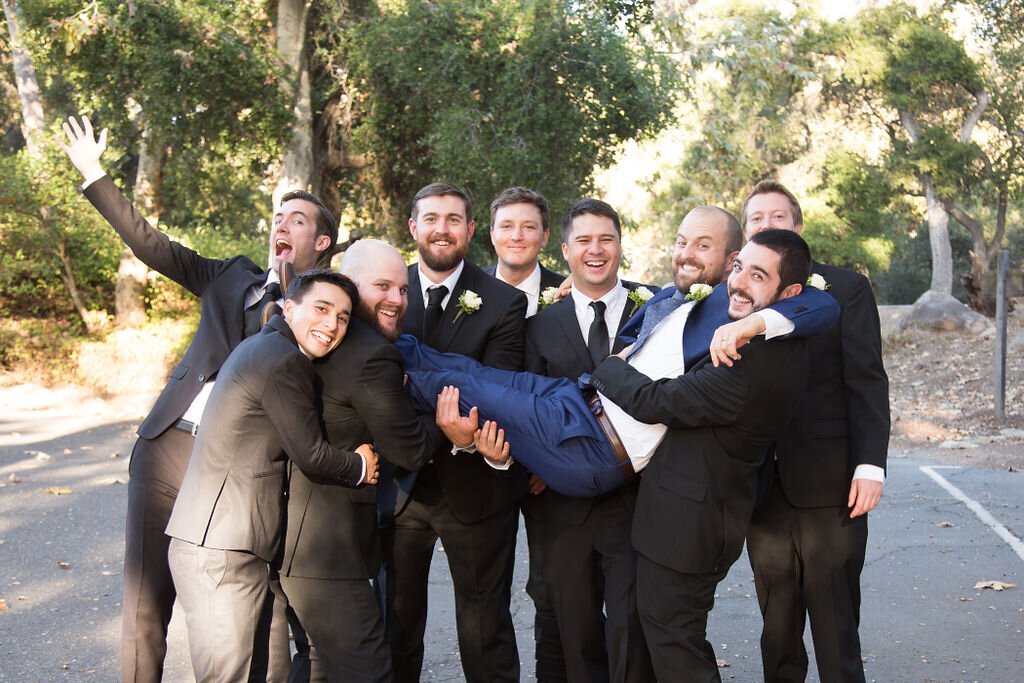 www.santabarbarawedding.com | Sarita Relis Photography | Felici Events | Rockwood Women’s Club | Alpha Floral | Groom and Groomsmen Share a Laugh During a Group Pose