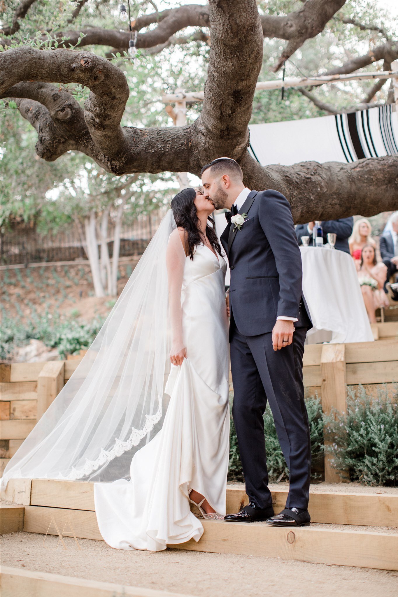 www.santabarbarawedding.com | Brilliant Wedding Co. | Michael &amp; Anna Costa Photography | Margaret Joan Florals | Cheek to Cheek Artistry | Bride and Groom Kiss After the Ceremony