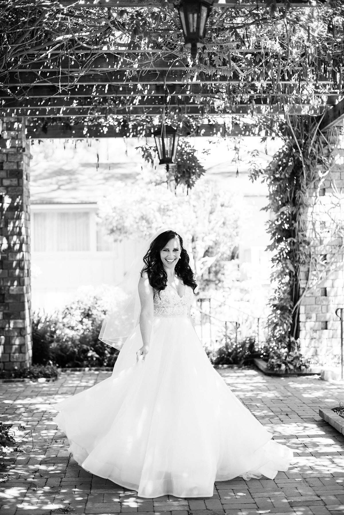 www.santabarbarawedding.com | ByCherry Photography | Belmond El Encanto | Hogue Floral | Santa Barbara Hair &amp; Makeup | Bride Twirling in Her Wedding Gown