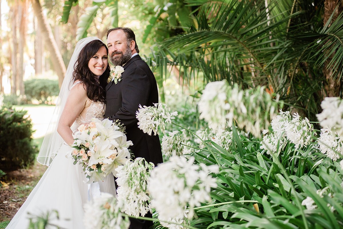 www.santabarbarawedding.com | ByCherry Photography | Santa Barbara Courthouse | Hogue Floral | Santa Barbara Hair &amp; Makeup | Bride and Groom by the Flower Blossoms