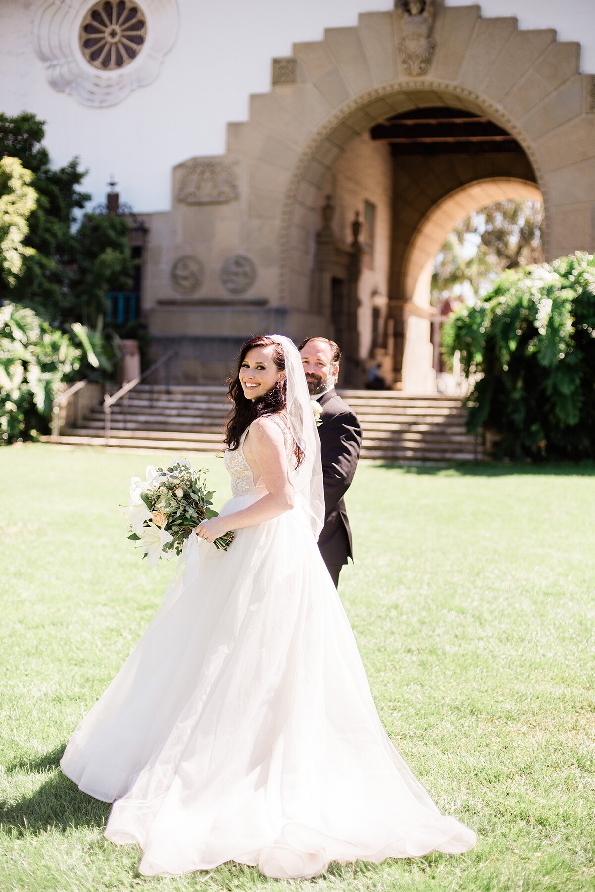 www.santabarbarawedding.com | ByCherry Photography | Santa Barbara Courthouse | Hogue Floral | Santa Barbara Hair &amp; Makeup | Bride and Groom on the Lawn in the Sunshine