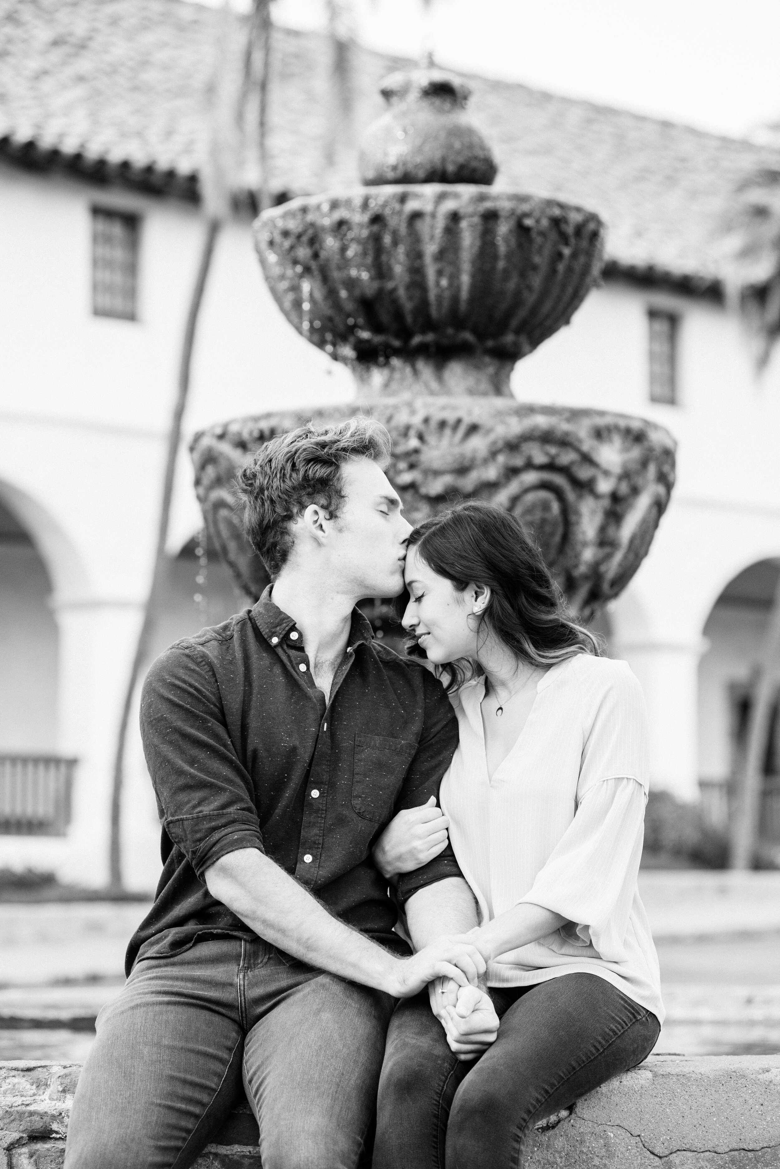 www.santabarbarawedding.com | ByCherry Photography | Old Mission Santa Barbara | Couple Embrace by the Fountain 