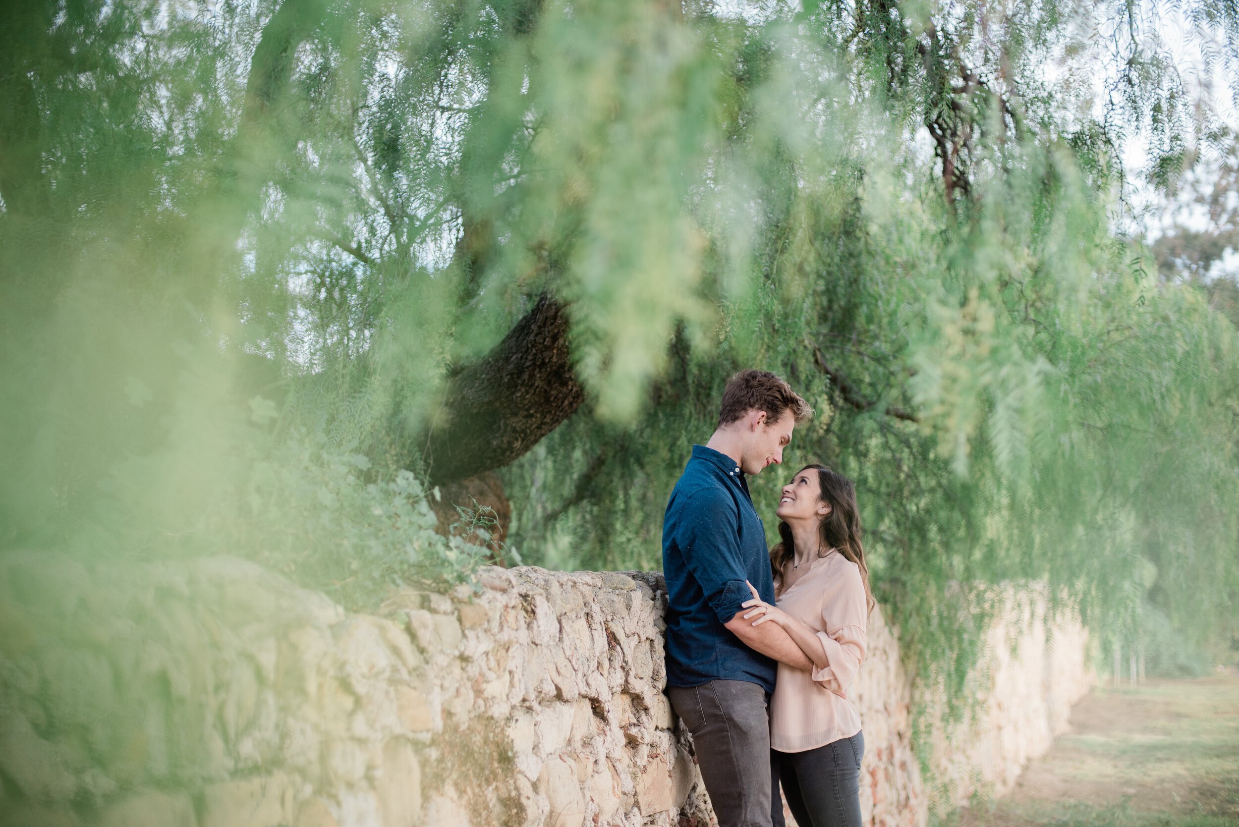 www.santabarbarawedding.com | ByCherry Photography | Butterfly Beach | Couple Embrace Under the Greenery