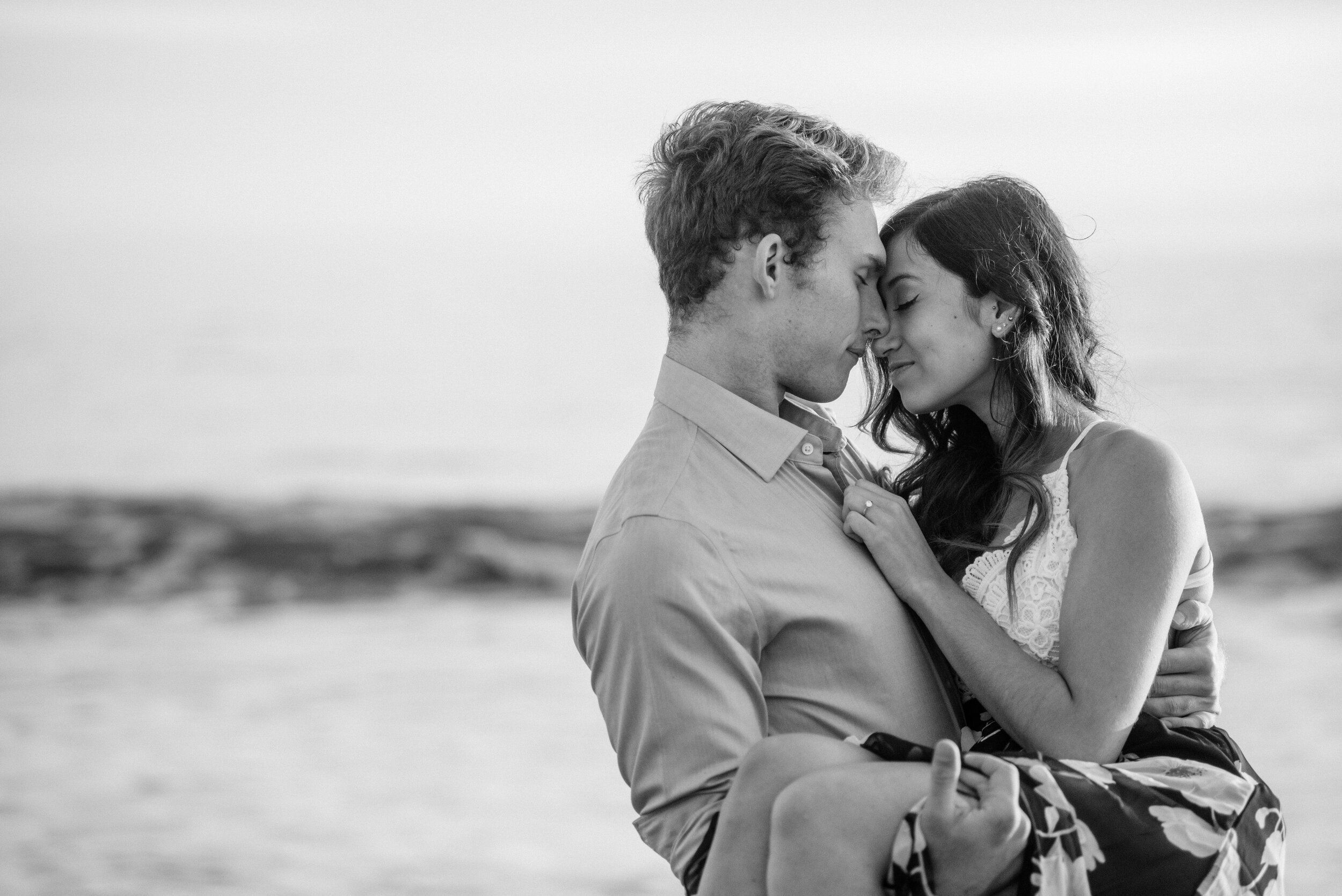 www.santabarbarawedding.com | ByCherry Photography | Butterfly Beach | Groom-to-Be Holding His Bride-to-be on the Beach