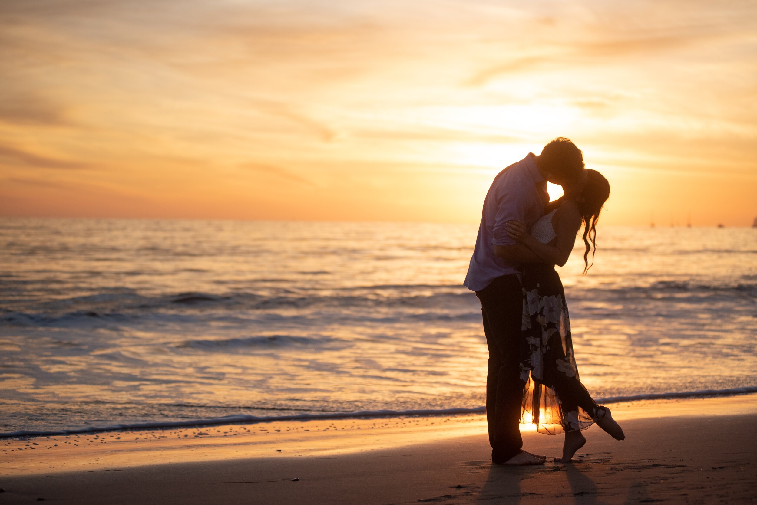 www.santabarbarawedding.com | ByCherry Photography | Butterfly Beach | Couple Kissing on the Beach at Sunset