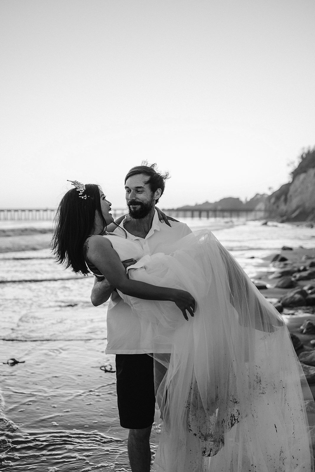 www.santabarbarawedding.com | Sarah Vendramini | The Ritz-Carlton Bacara | Lobo Floral | Mark Patterson | Groom Picking Up the Bride on the Beach