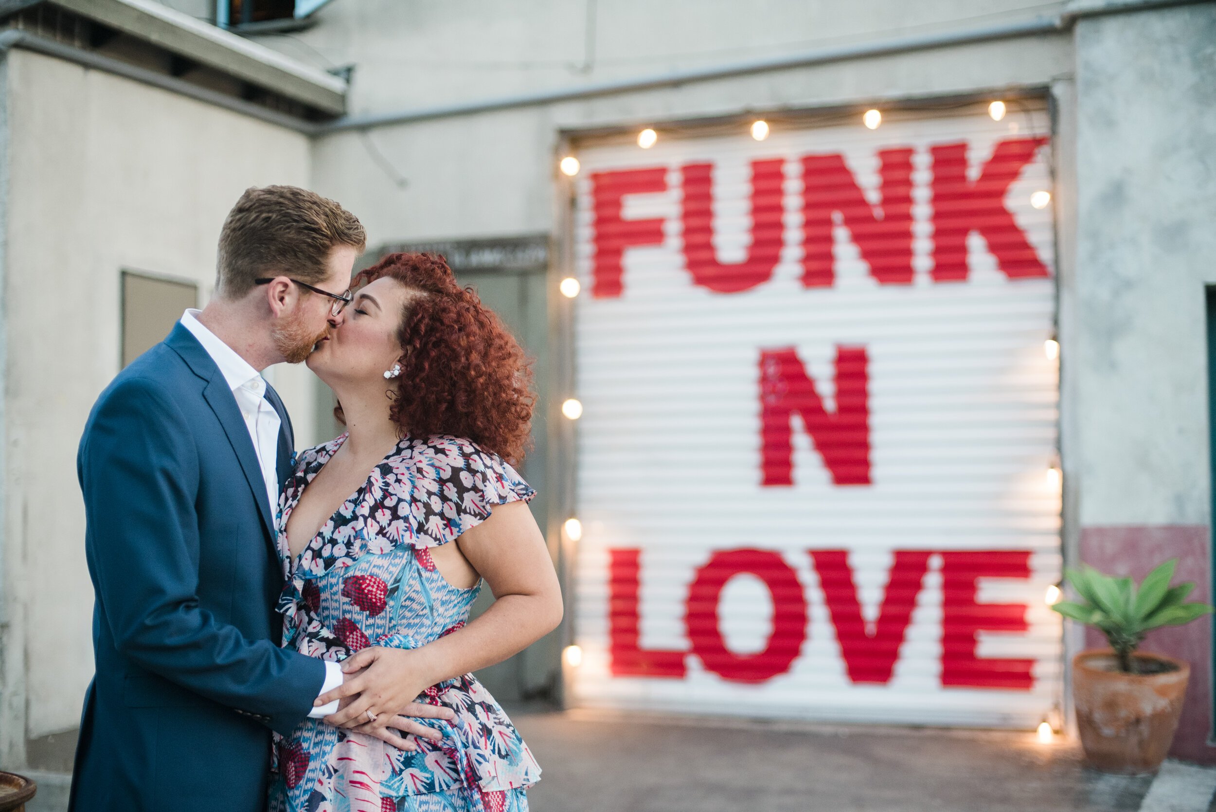 www.santabarbarawedding.com | ByCherry Photography | The Funk Zone | Engagement Pictures in Front of Funk in Love Garage Door