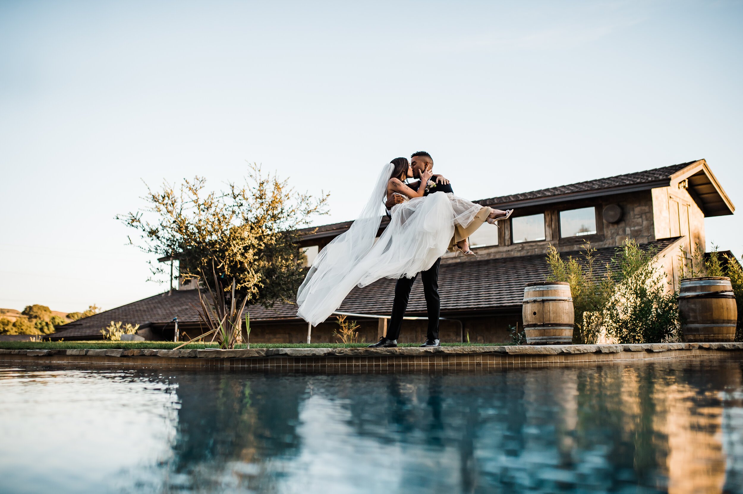 www.santabarbarawedding.com | The Tavern at Zaca Creek | Events by Fran | Michelle Ramirez Photography | Tangled Lotus | Friar Tux | Ever After Bridal | Jackie Romero | Bride and Groom by Pool