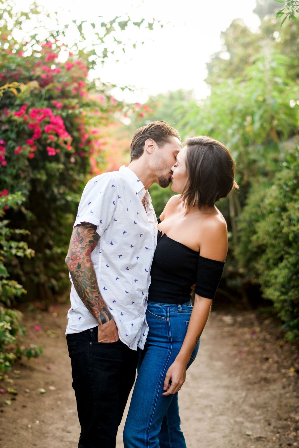 www.santabarbarawedding.com | Montecito | Julia Franzosa Photography | Engagement Photo of the Couple Kissing in The Garden 