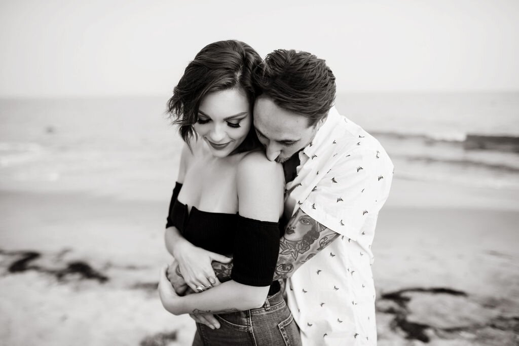 www.santabarbarawedding.com | Montecito | Julia Franzosa Photography | Engagement Photo of the Couple Embracing on the Beach 