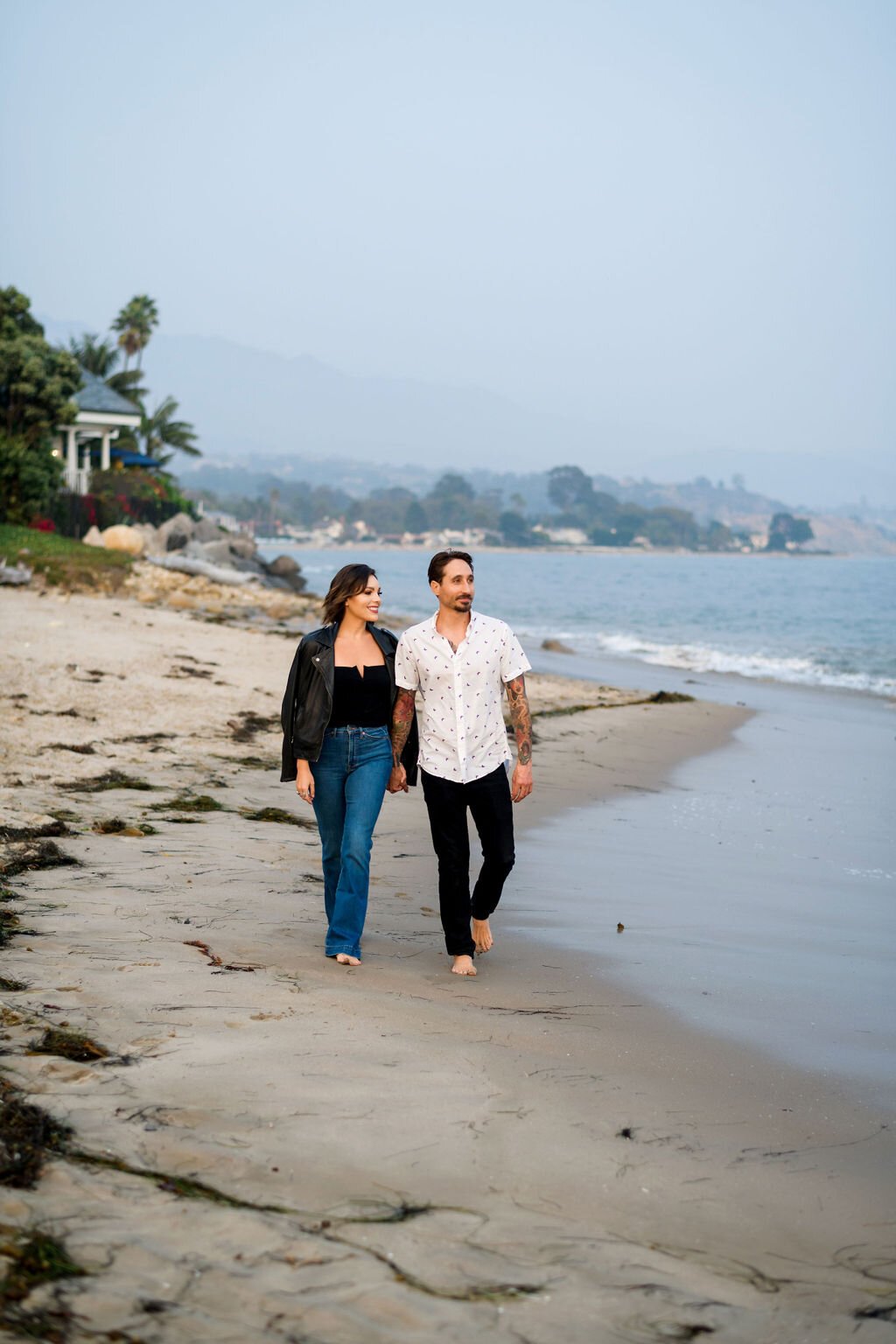 www.santabarbarawedding.com | Montecito | Julia Franzosa Photography | Engagement Photo of the Couple Walking on the Beach 