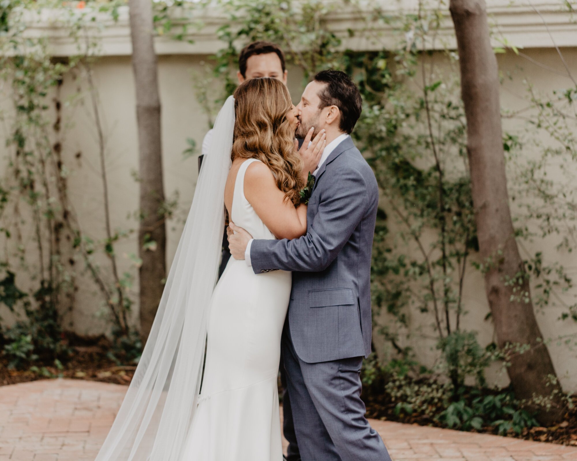 www.santabarbarawedding.com | Kyle London Photography | Santa Barbara Club | Sweet Pea Flowers | Theia | Moondance Bridal | Bride and Groom Kiss at The Ceremony 