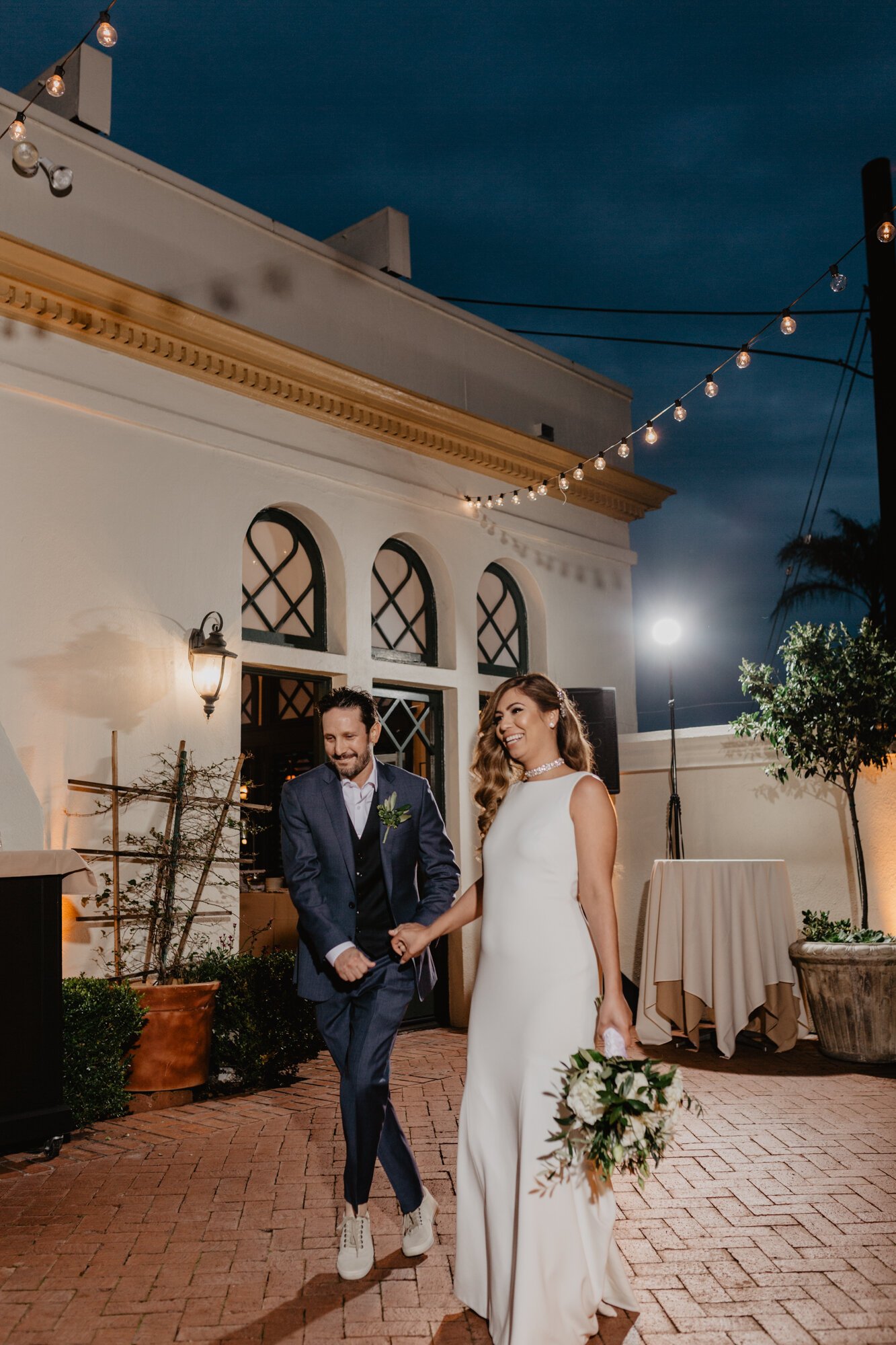 www.santabarbarawedding.com | Kyle London Photography | Santa Barbara Club | Sweet Pea Flowers | Theia | DJ Hecktik | Bride and Groom Arrive at Reception 