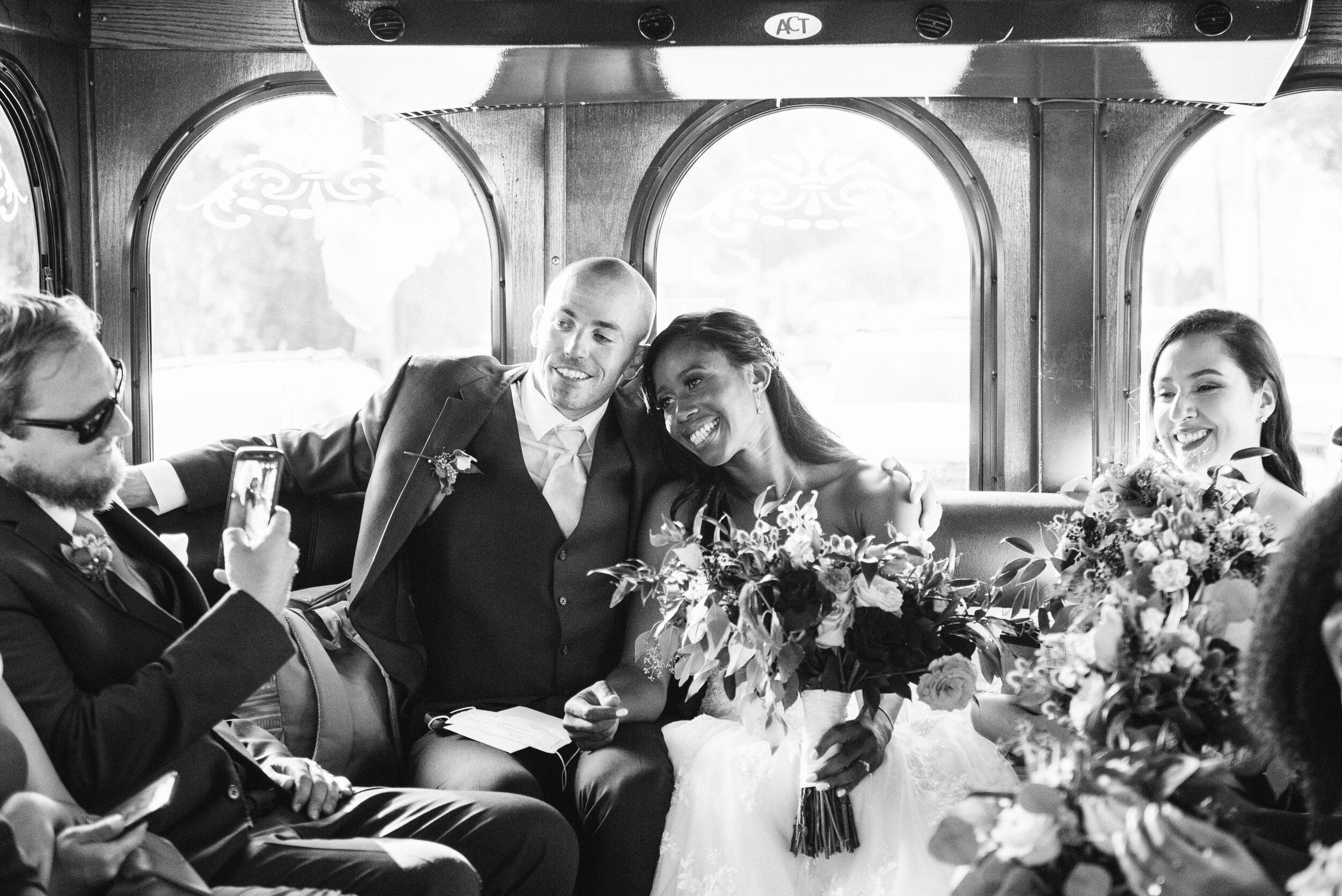 www.santabarbarawedding.com | ByCherry Photography | Floral Designs by Roni | Queen Peaa | SB Trolley | Bride and Groom in Trolley Headed to the Reception