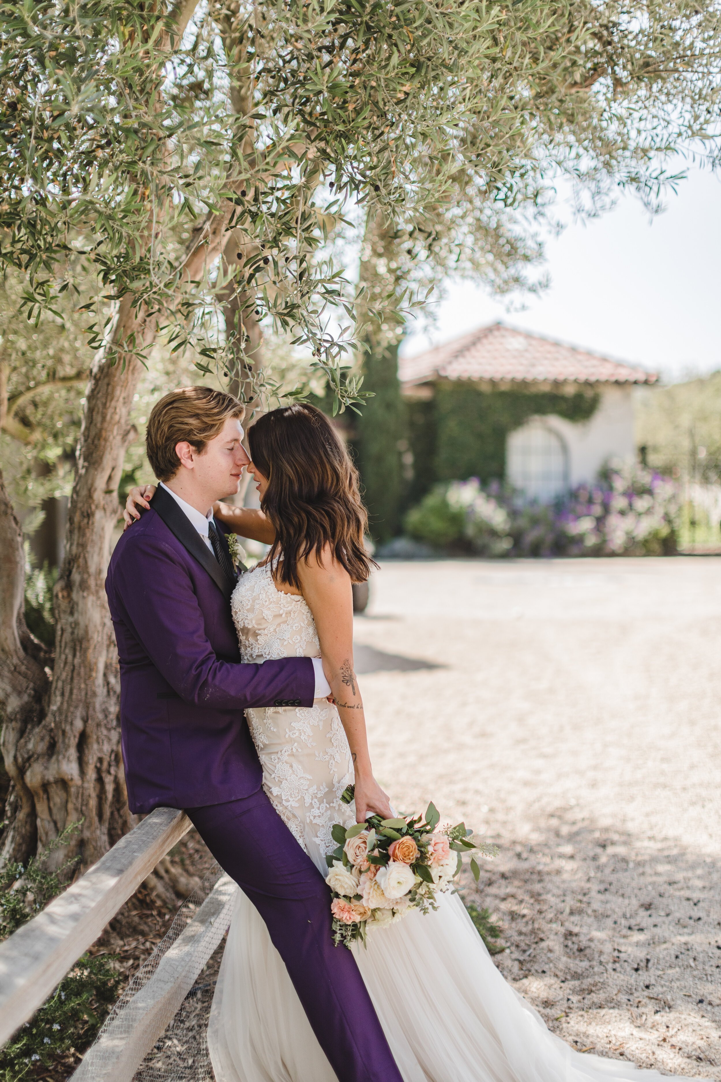 www.santabarbarawedding.com | Klentner Ranch | Santa Barbara Wedding Coordinator | Waller Weddings | The Twisted Twig | Bride and Groom Kiss on the Fence