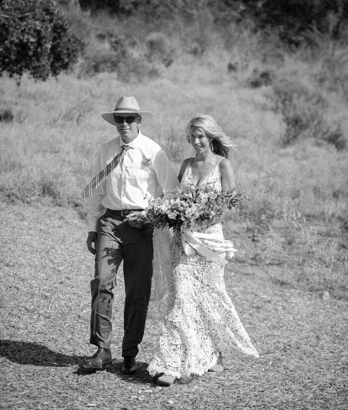 www.santabarbarawedding.com | Private Ranch | Soigne Productions | Bri Burkett Wedding | Nina Osborne Designs | Bride Walking Down Aisle with Father