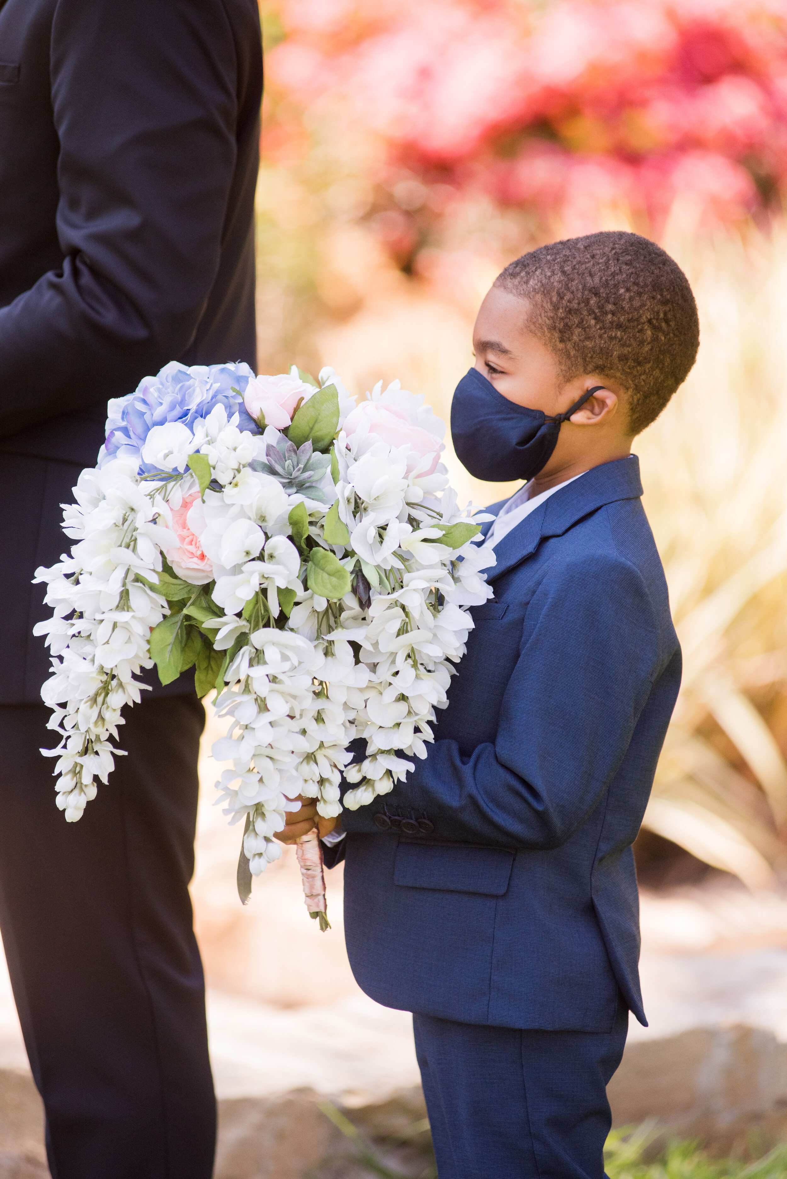 www.santabarbarawedding.com | ByCherry Photography | Santa Barbara Courthouse | Bride and Groom’s Son Holds Bride’s Bouquet at the Ceremony 