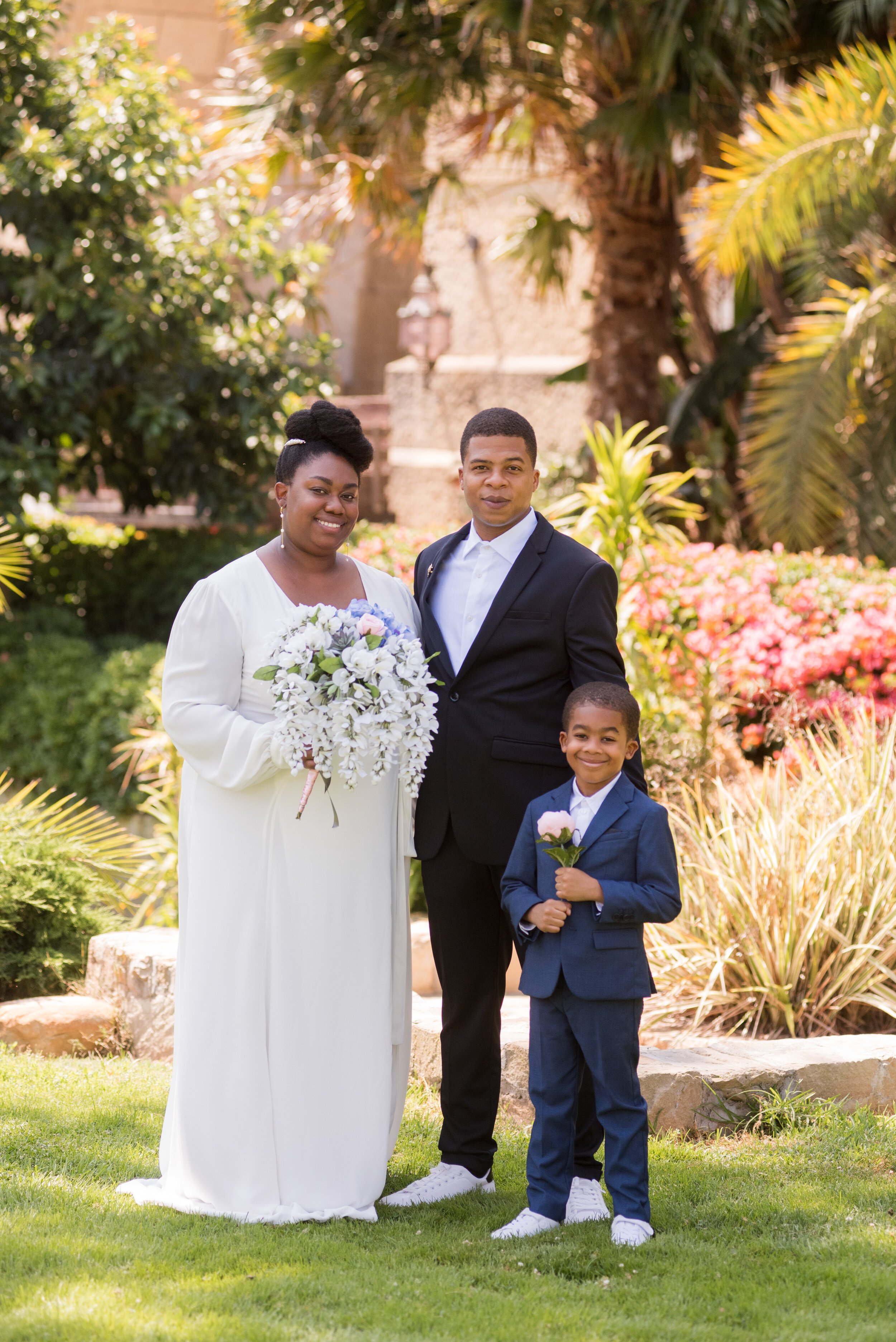 www.santabarbarawedding.com | ByCherry Photography | Santa Barbara Courthouse | Bride and Groom and Their Son  Outside the Courthouse