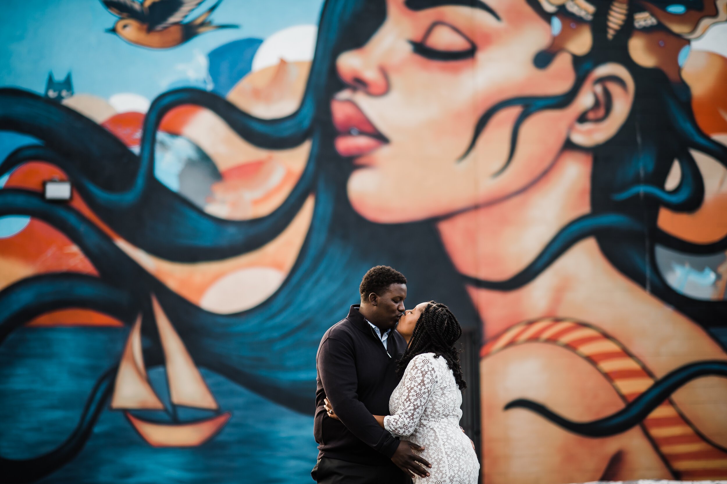 www.santabarbarawedding.com | Michelle Ramirez Photography | Couple Engagement Shoot in Front of Mural in Downtown Ventura