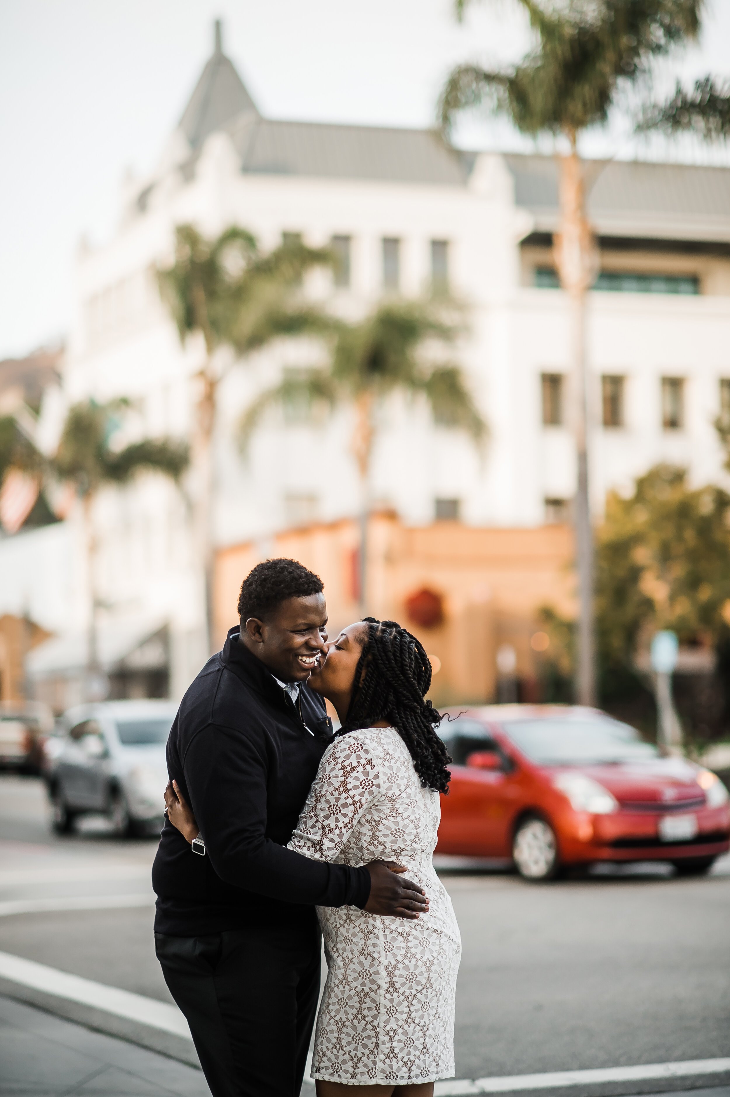 www.santabarbarawedding.com | Michelle Ramirez Photography | Couple Kisses in the Streets of Downtown Ventura