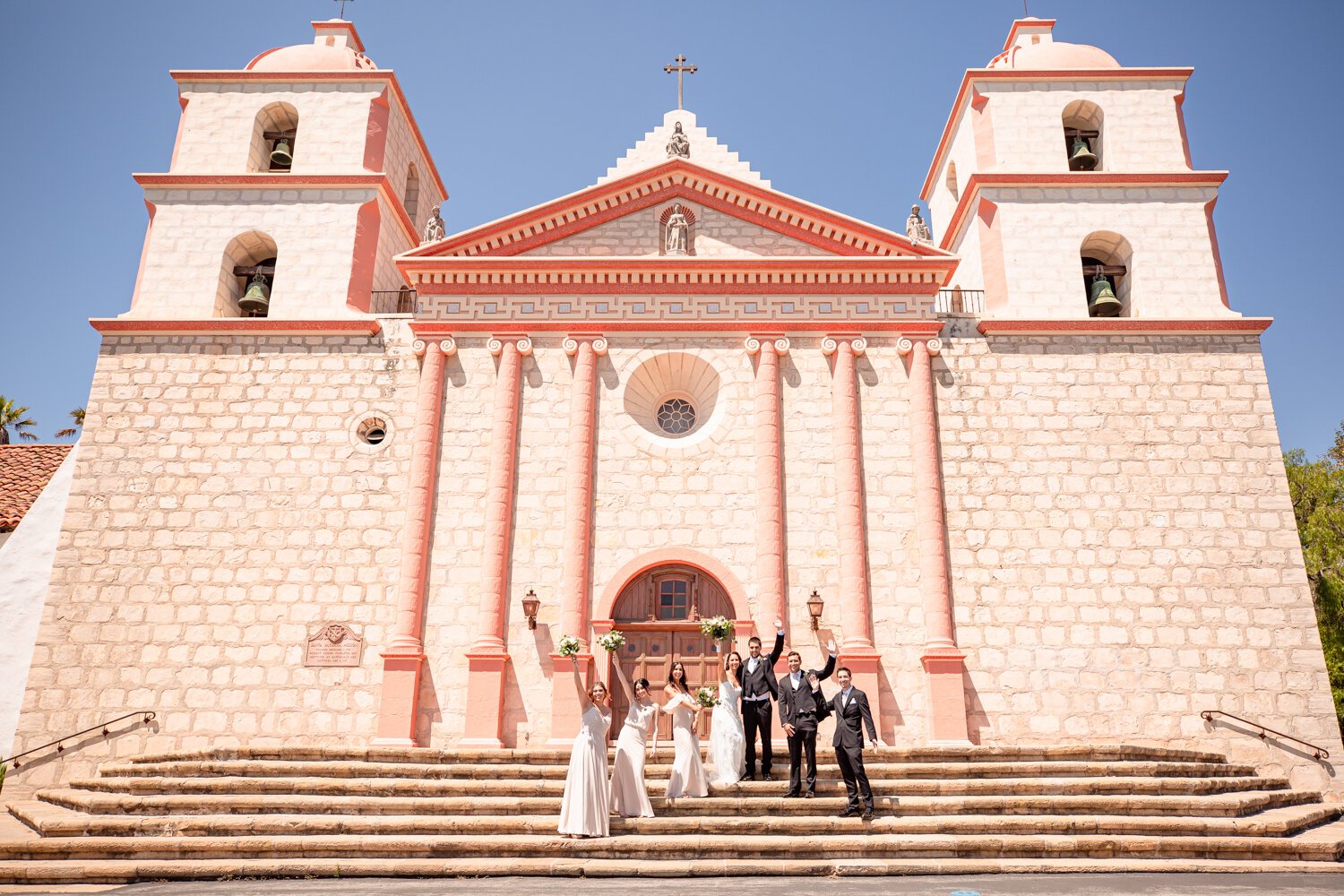 www.santabarbarawedding.com | Kiernan Michelle Photography | Old Mission Santa Barbara | Sohi Productions | Bride and Groom with Wedding Party on Steps of Old Mission