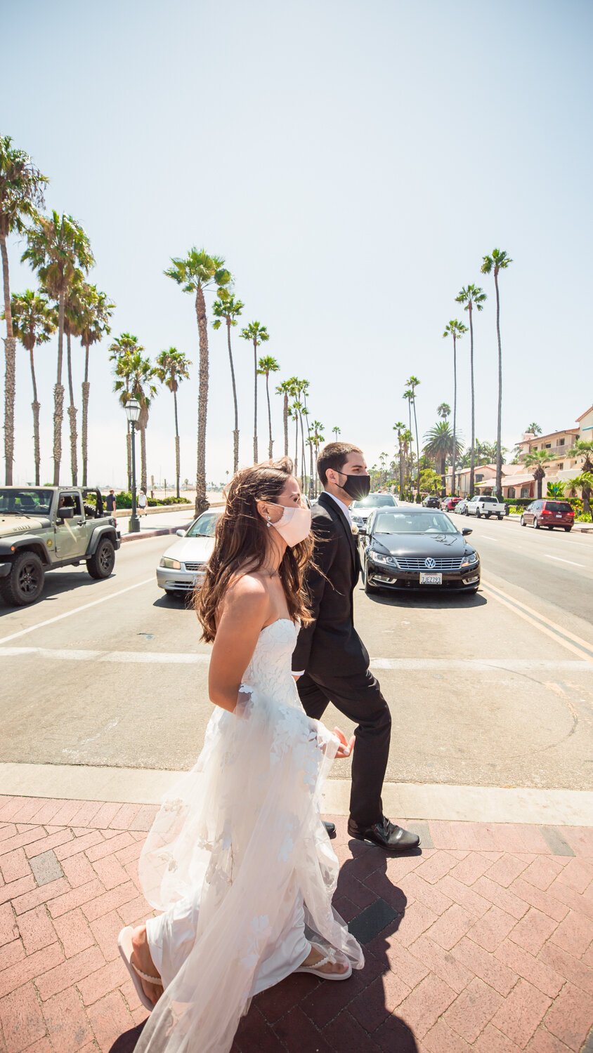 www.santabarbarawedding.com | Kiernan Michelle Photography | Stearns Wharf | Sohi Productions | Bride and Groom Walk Across the Street in Santa Barbara
