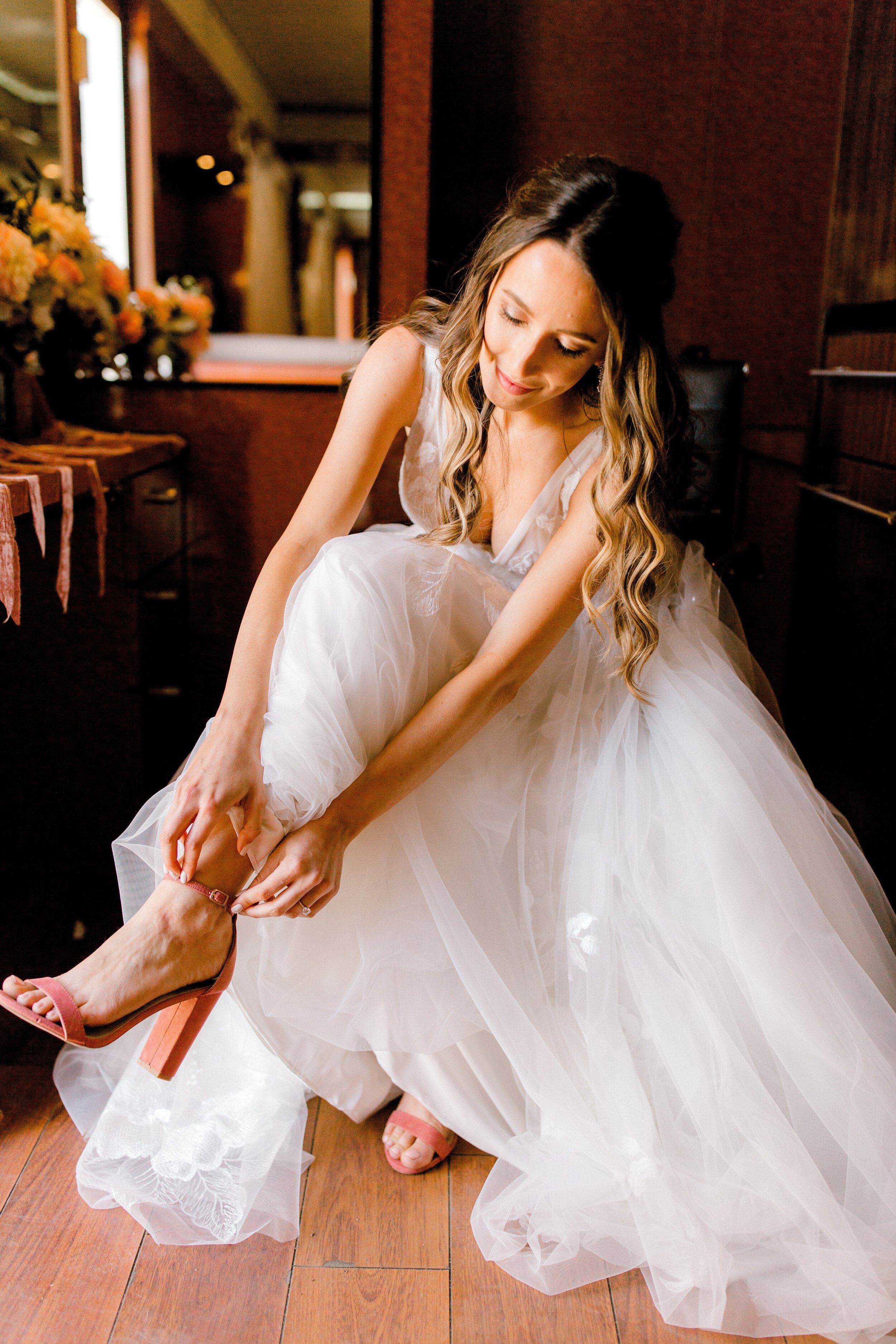 www.santabarbarawedding.com | Events by Fran | Brooke Borough Photography | Triunfo Creek Vineyards | Blushing Beauty | Lili Bridals | Bride Putting on Her Shoes