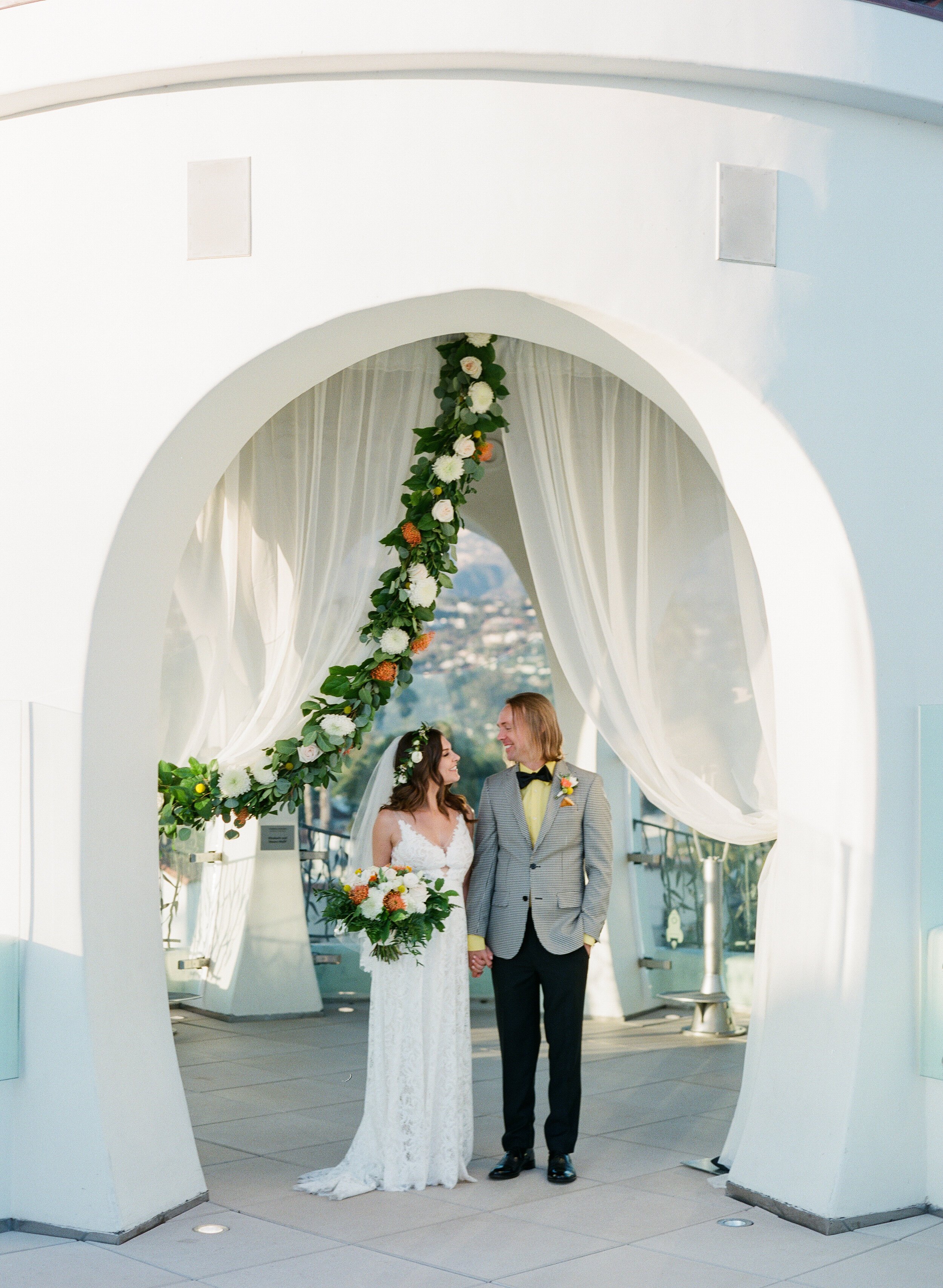 www.santabarbarawedding.com | KB Events | Michael + Anna Costa Photography | Couple Under Beautiful White Arch 